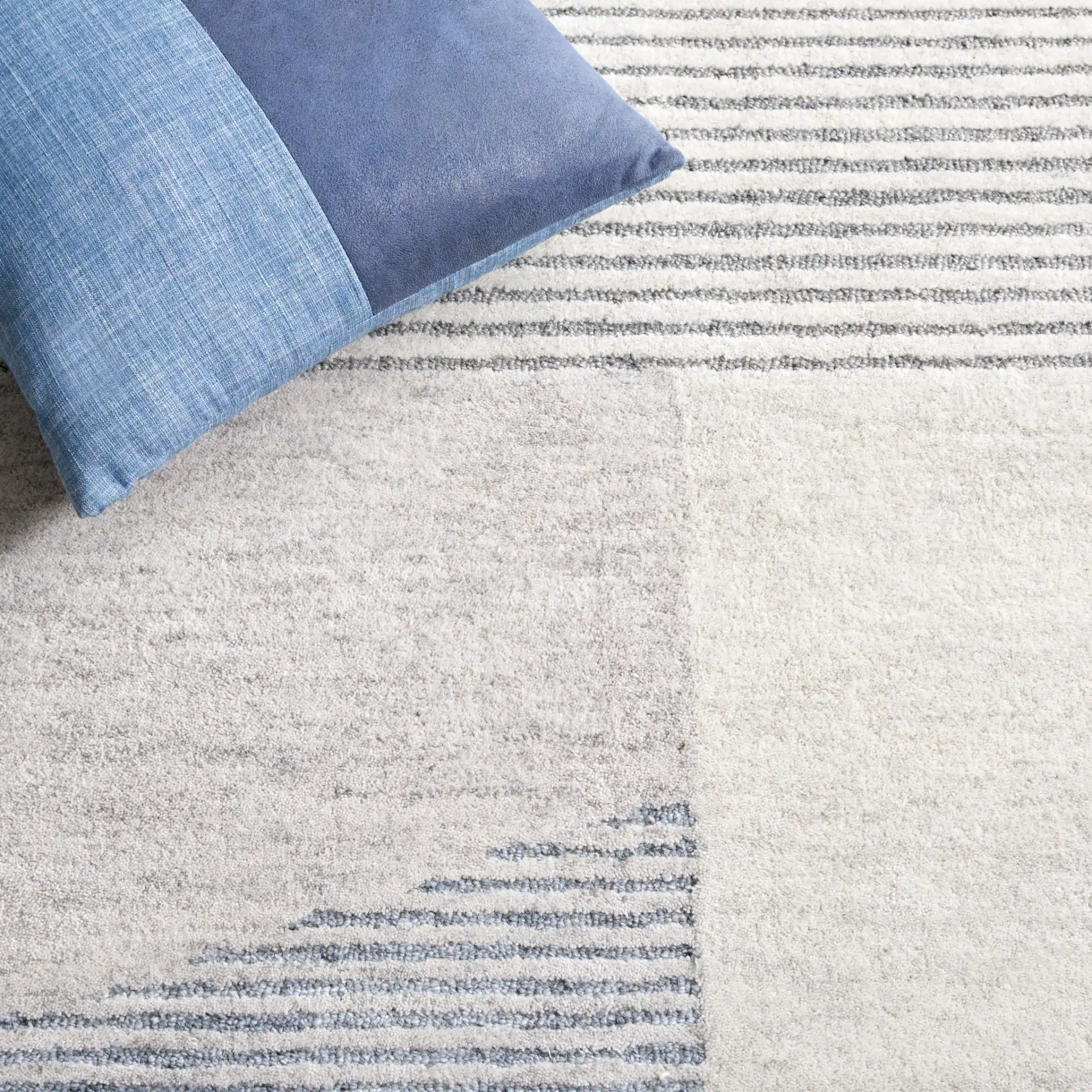 Ebony Linear Block Hand-Tufted Rug in Beige / Gray in a styled room