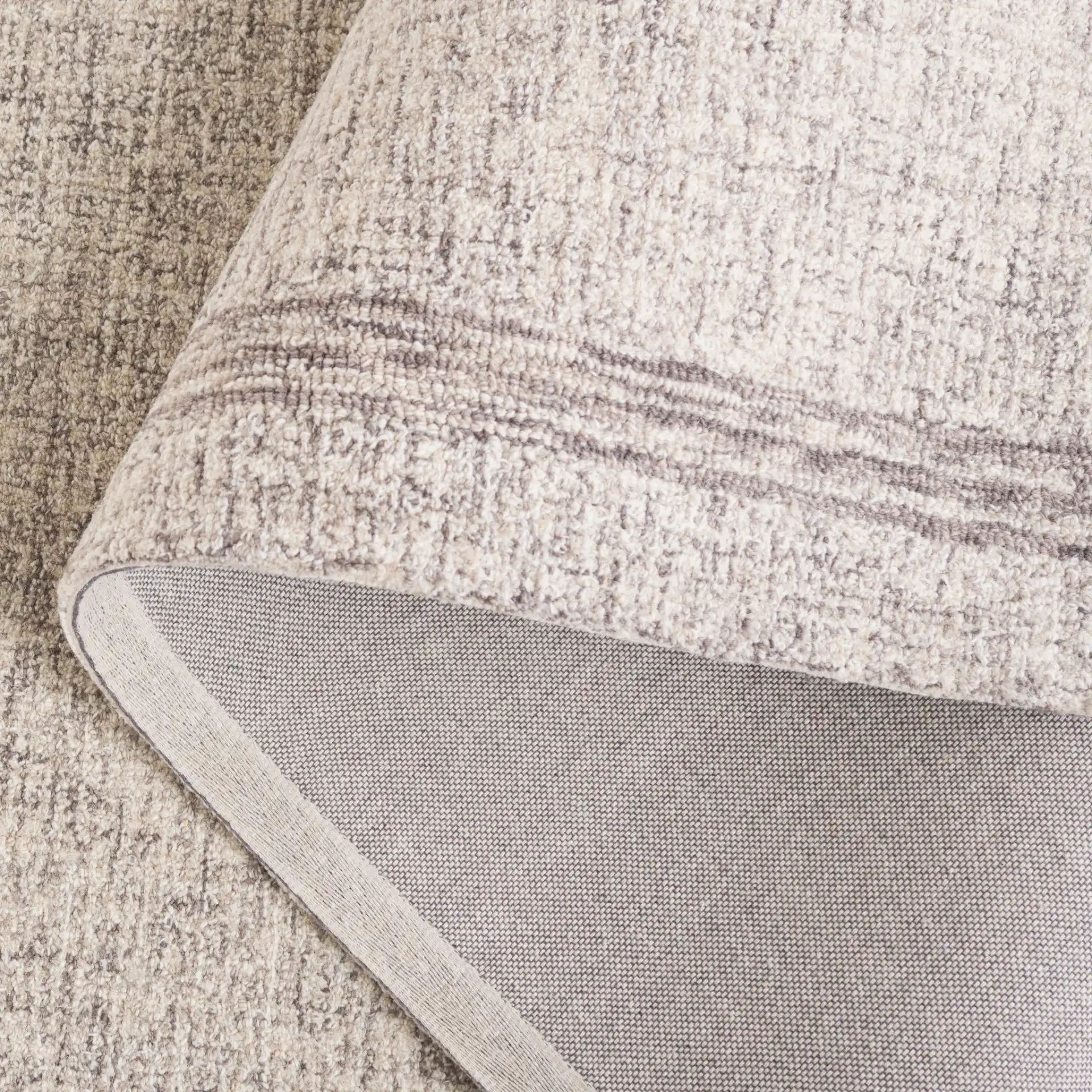 Ebony Bordered Hand-Tufted Wool Rug in Gray in a styled room