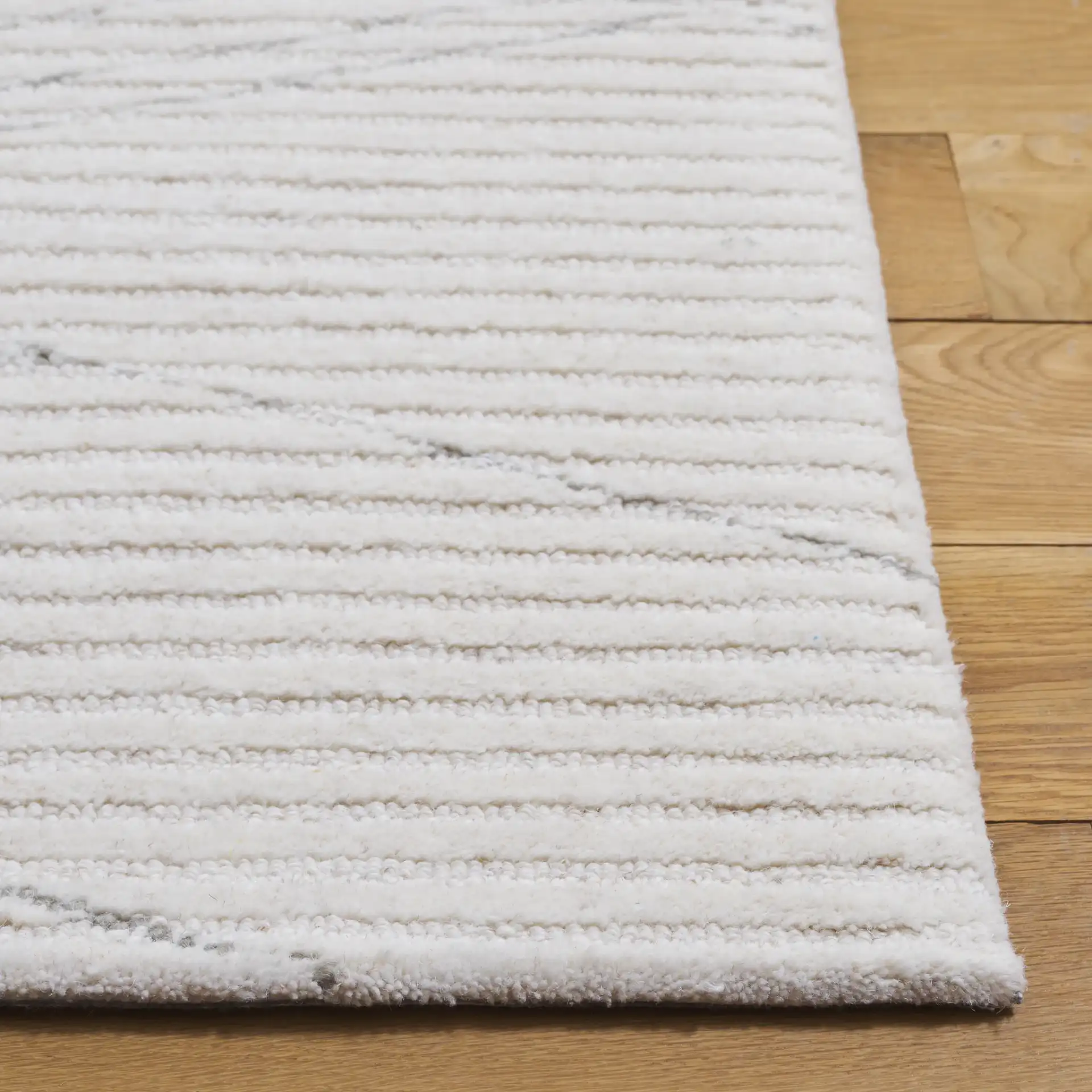 Ebony Linear Hand-Tufted Wool Rug in Ivory / Gray in a styled room