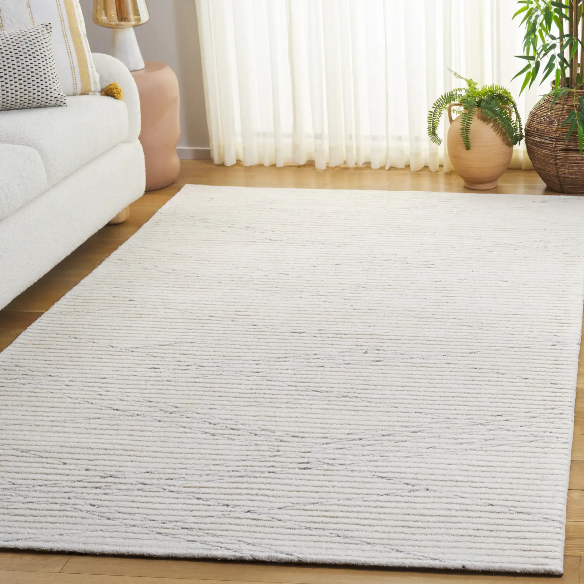 Ebony Linear Hand-Tufted Wool Rug in Ivory / Gray in a styled room