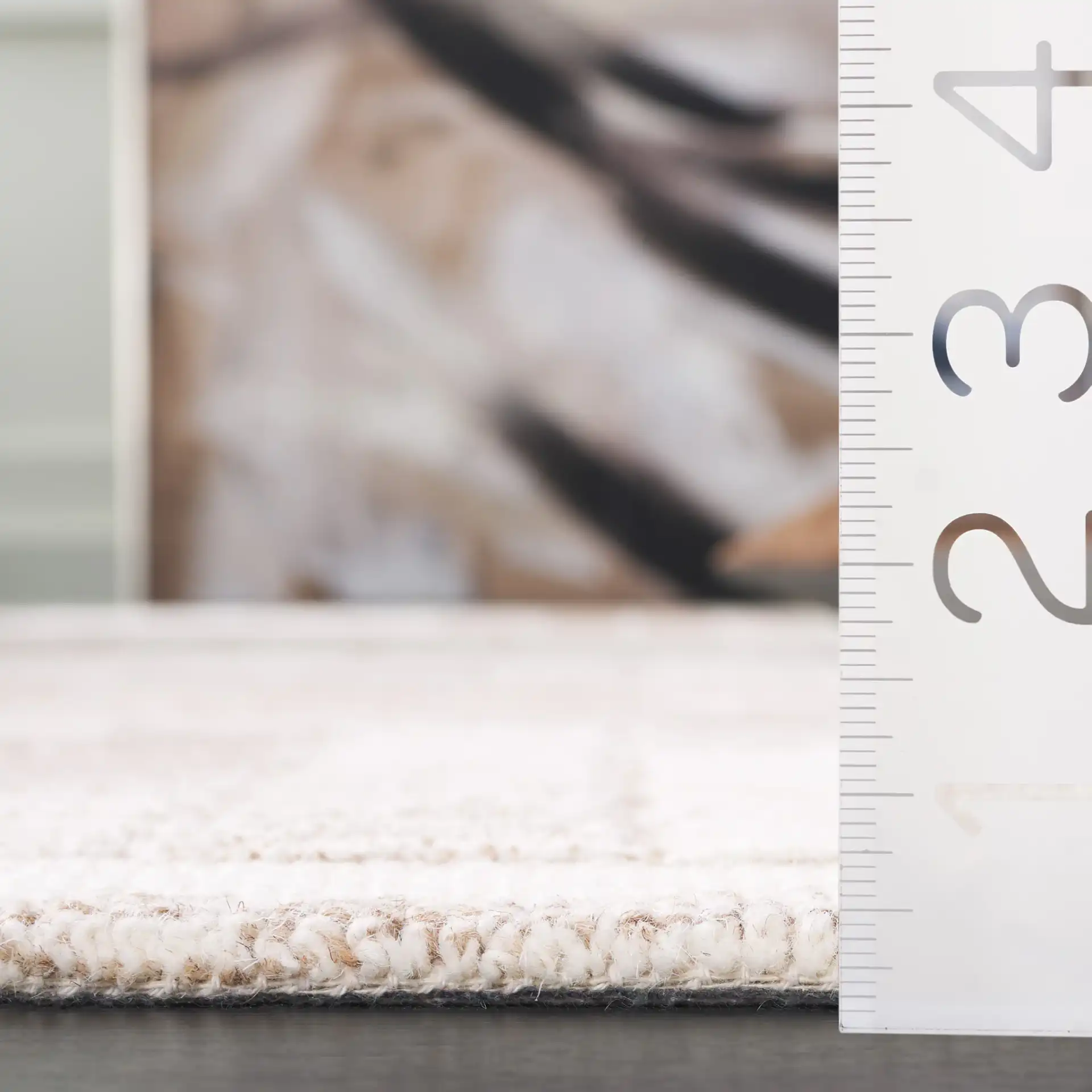 Ebony Mosaic Hand-Tufted Wool Rug in Ivory / Brown in a styled room