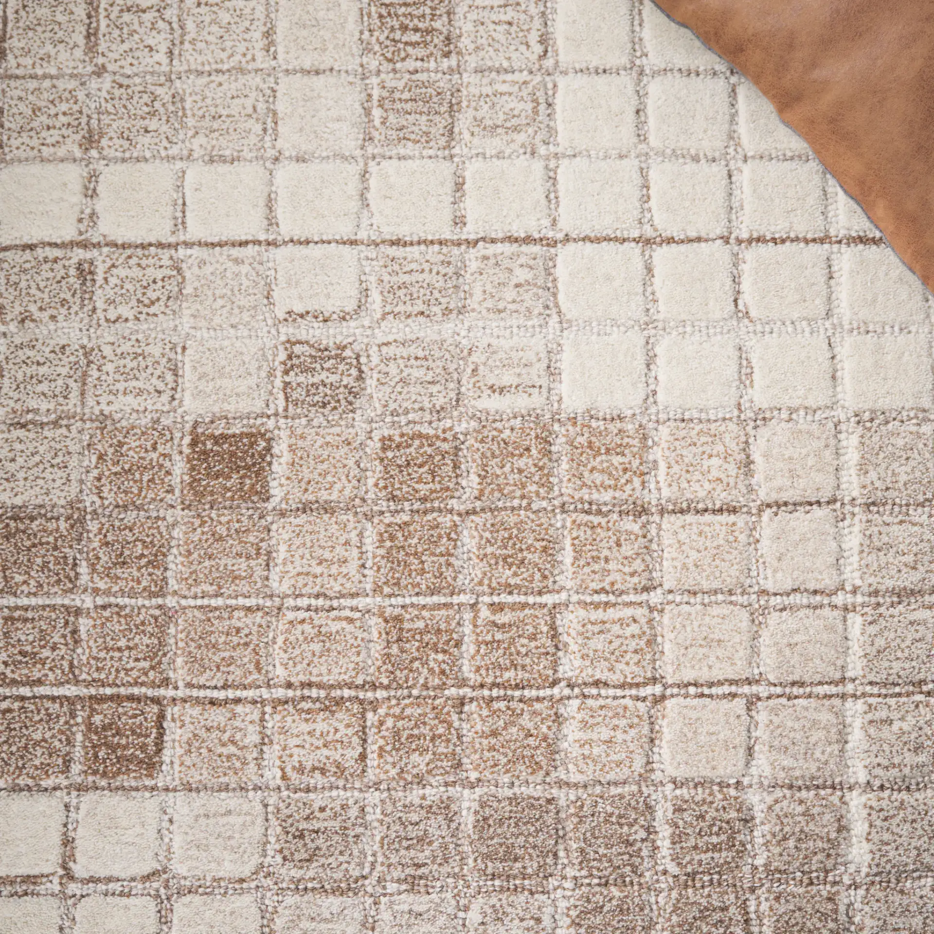 Ebony Mosaic Hand-Tufted Wool Rug in Ivory / Brown in a styled room