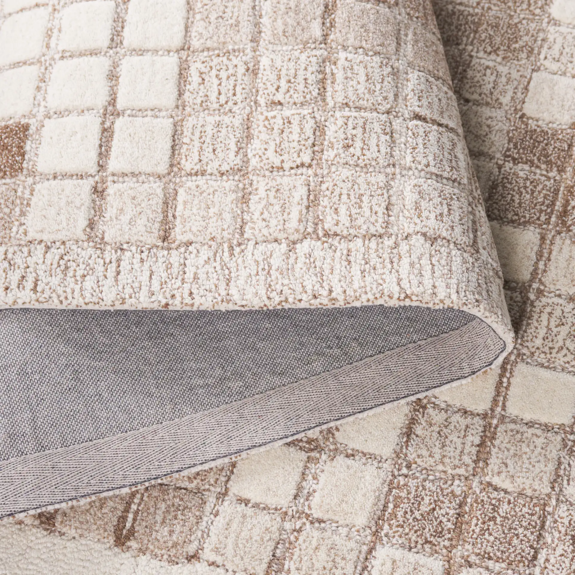 Ebony Mosaic Hand-Tufted Wool Rug in Ivory / Brown in a styled room