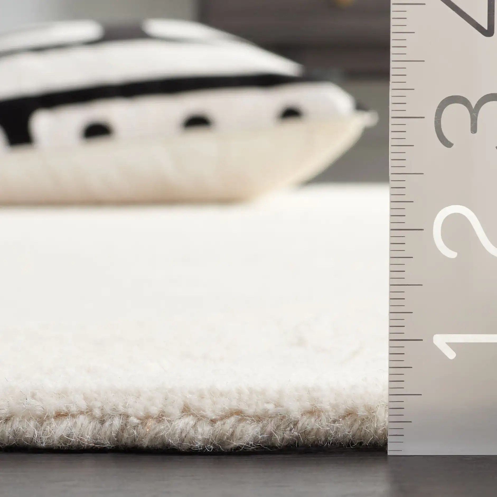 Ebony Overlapping Circles Hand-Tufted Wool Rug in Ivory in a styled room