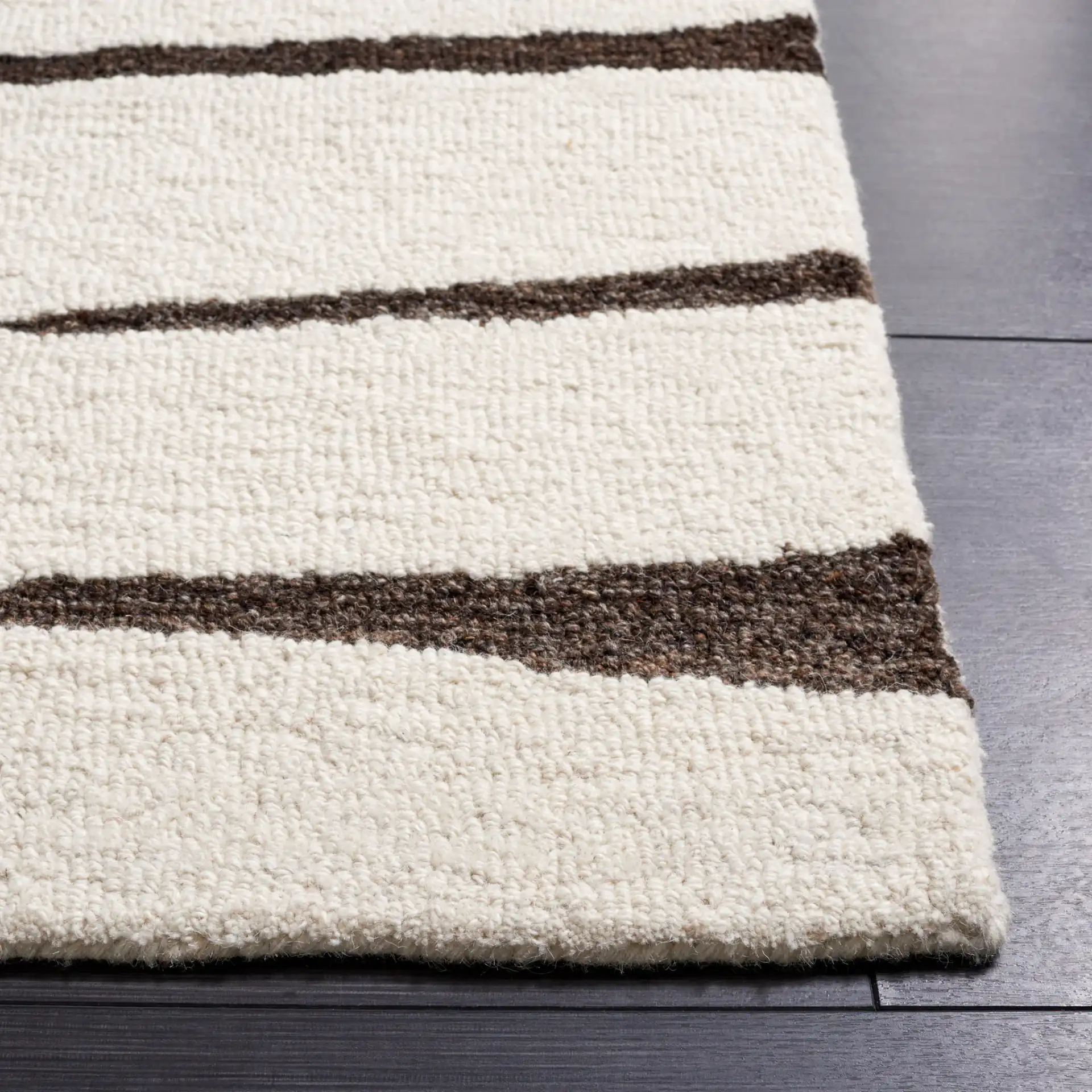 Ebony Linear Grid Hand-Tufted Wool Rug in Ivory / Dark Brown in a styled room