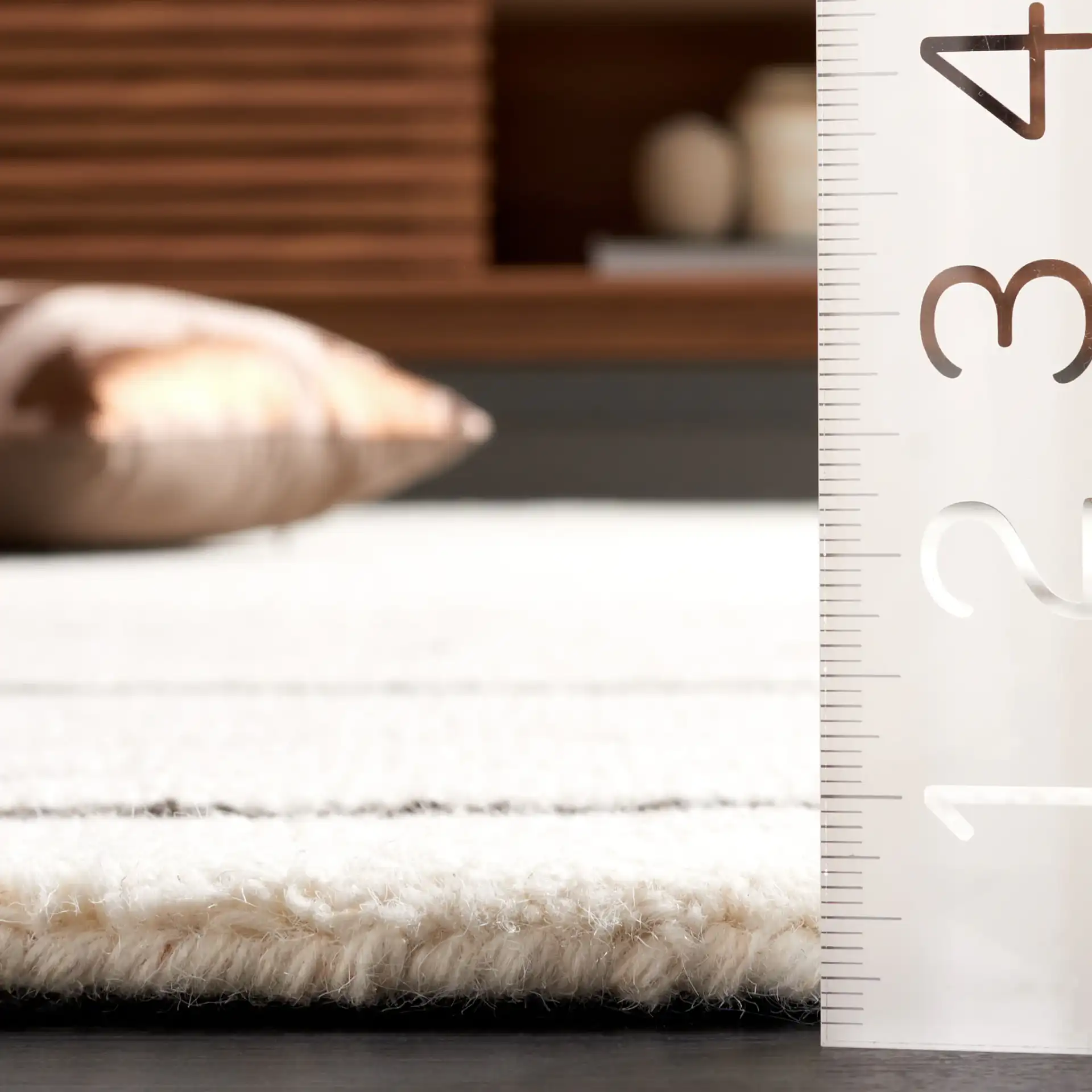 Ebony Linear Grid Hand-Tufted Wool Rug in Ivory / Dark Brown in a styled room