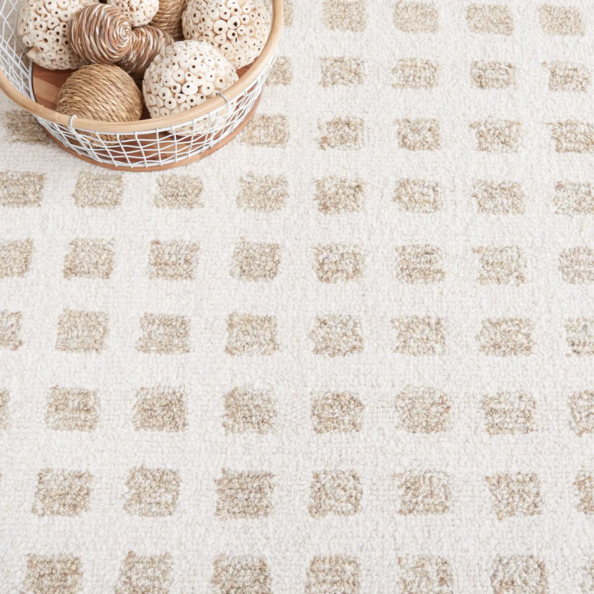 Ebony Checkered Hand-Tufted Rug in Ivory / Beige in a styled room