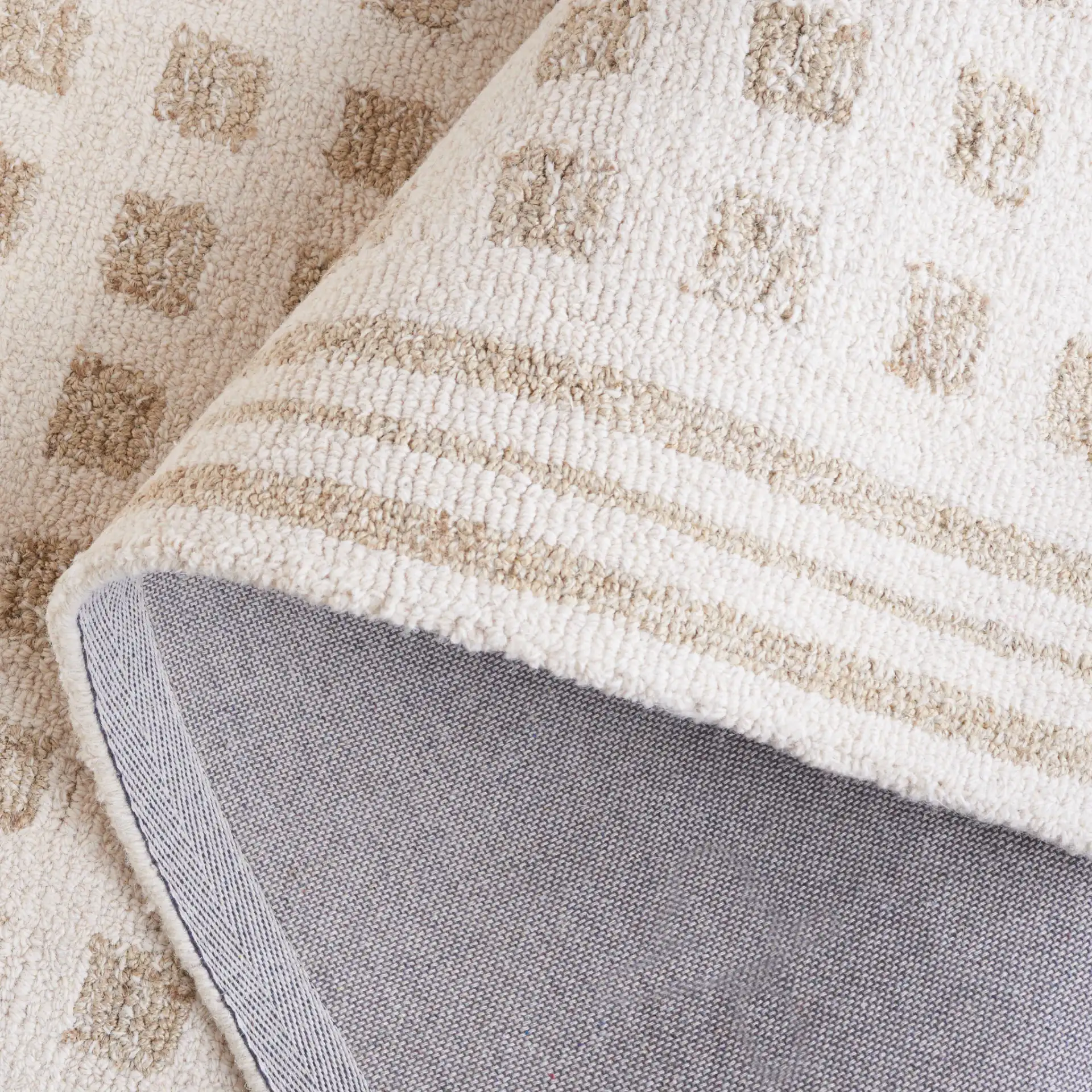 Ebony Checkered Hand-Tufted Rug in Ivory / Beige in a styled room