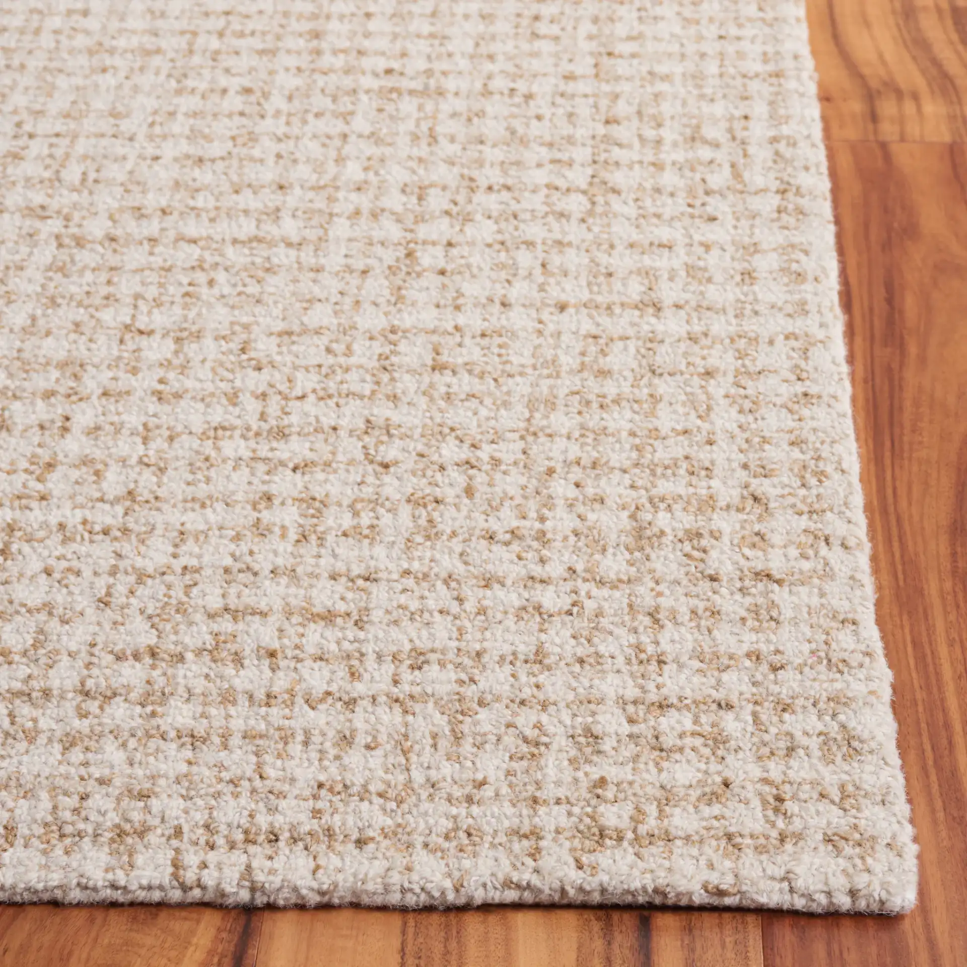 Ebony Waffle Grid Hand-Tufted Rug in Beige / Gold in a styled room