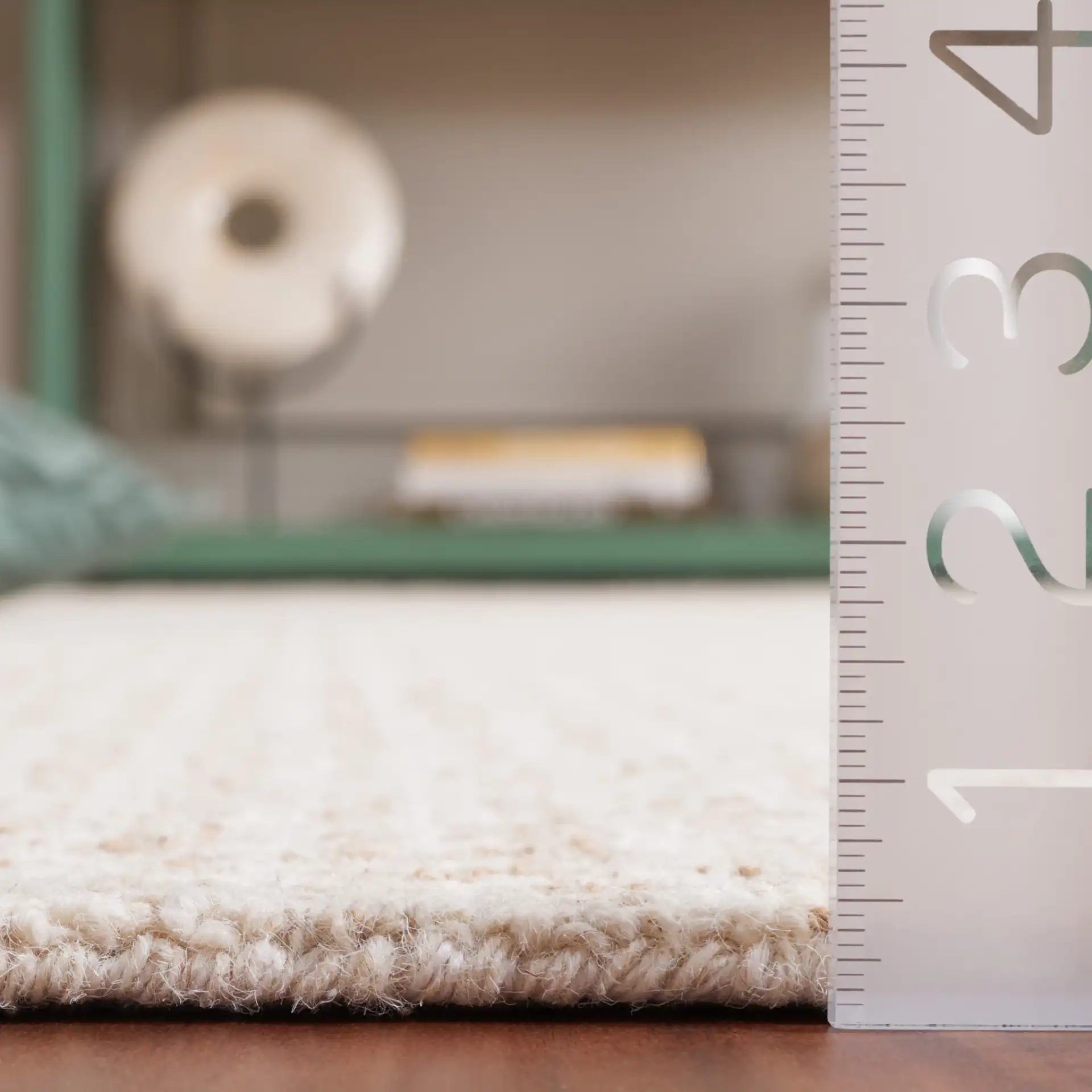 Ebony Waffle Grid Hand-Tufted Rug in Beige / Gold in a styled room