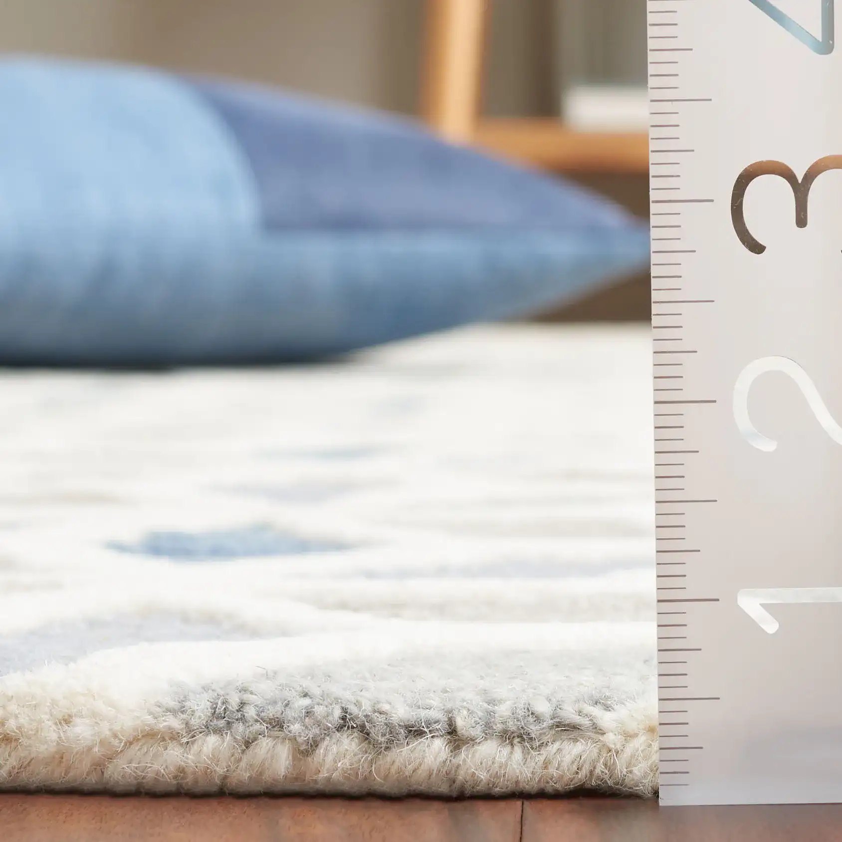 Ebony Cube Hand-Tufted Wool Rug in Ivory / Blue in a styled room