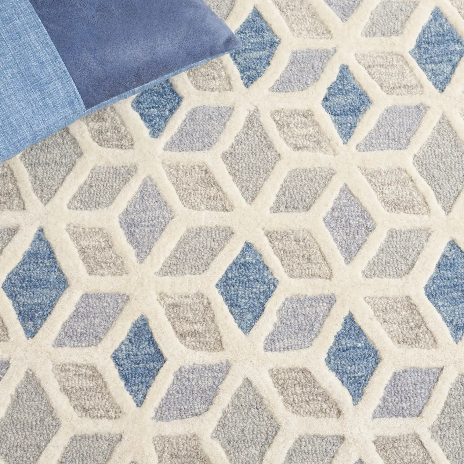 Ebony Cube Hand-Tufted Wool Rug in Ivory / Blue in a styled room
