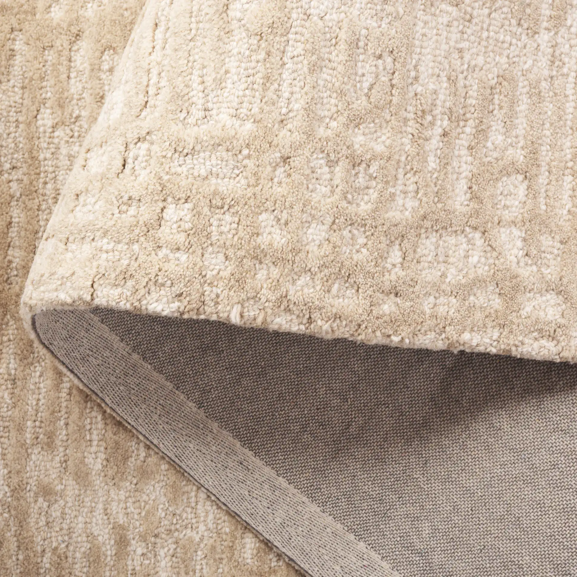 Ebony Linear Block Hand-Tufted Wool Rug in Beige / Ivory in a styled room