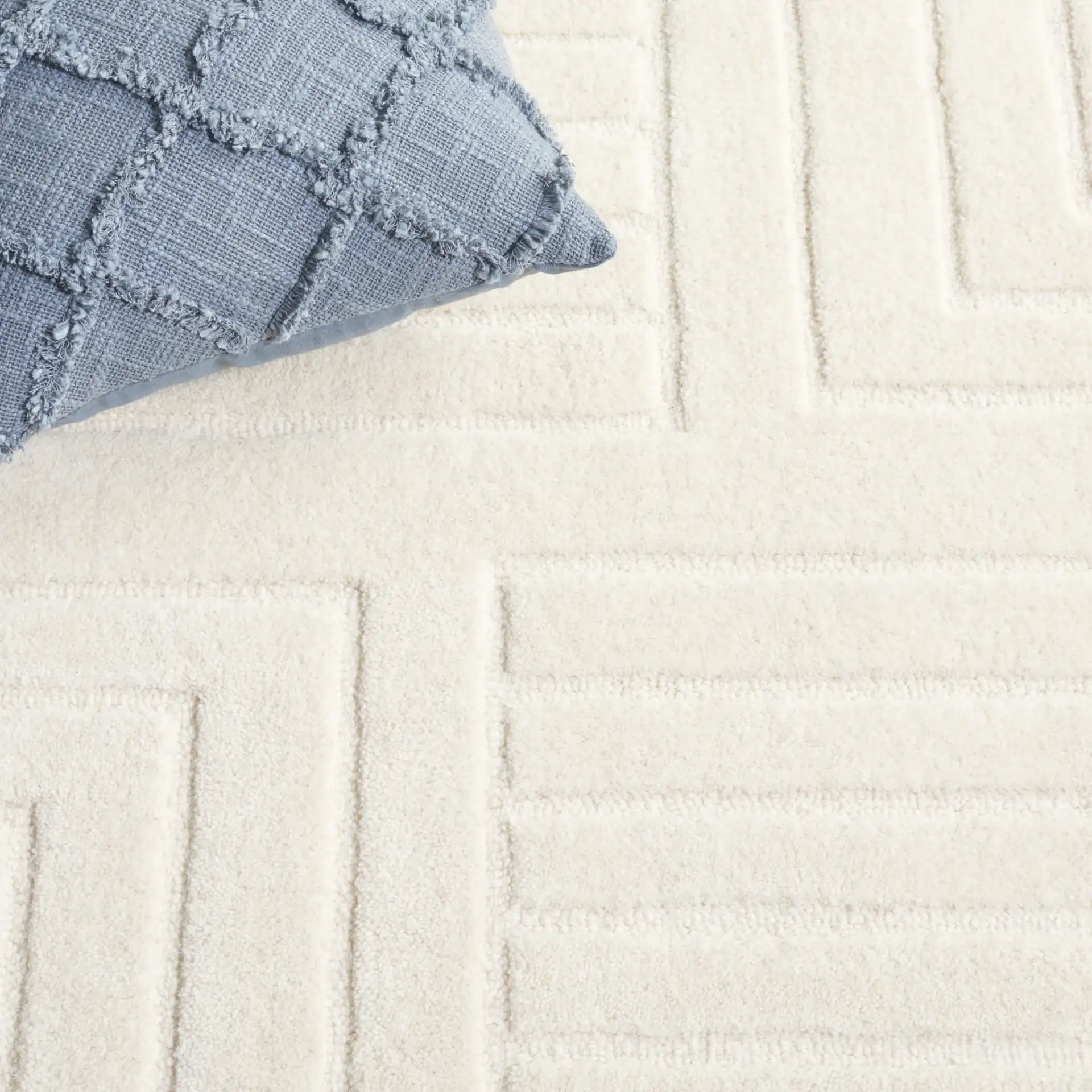 Ebony Linear Geometric Hand-Tufted Wool Rug in Ivory in a styled room