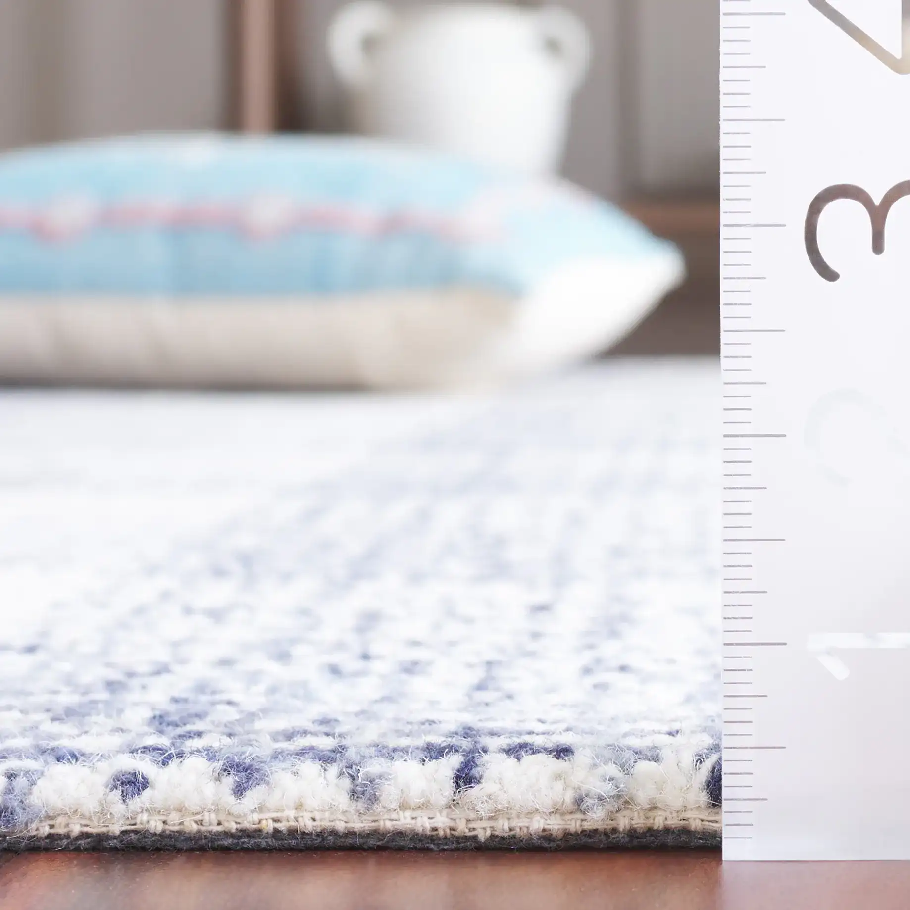 Ebony Plaid Hand-Tufted Wool Rug in Ivory / Blue in a styled room