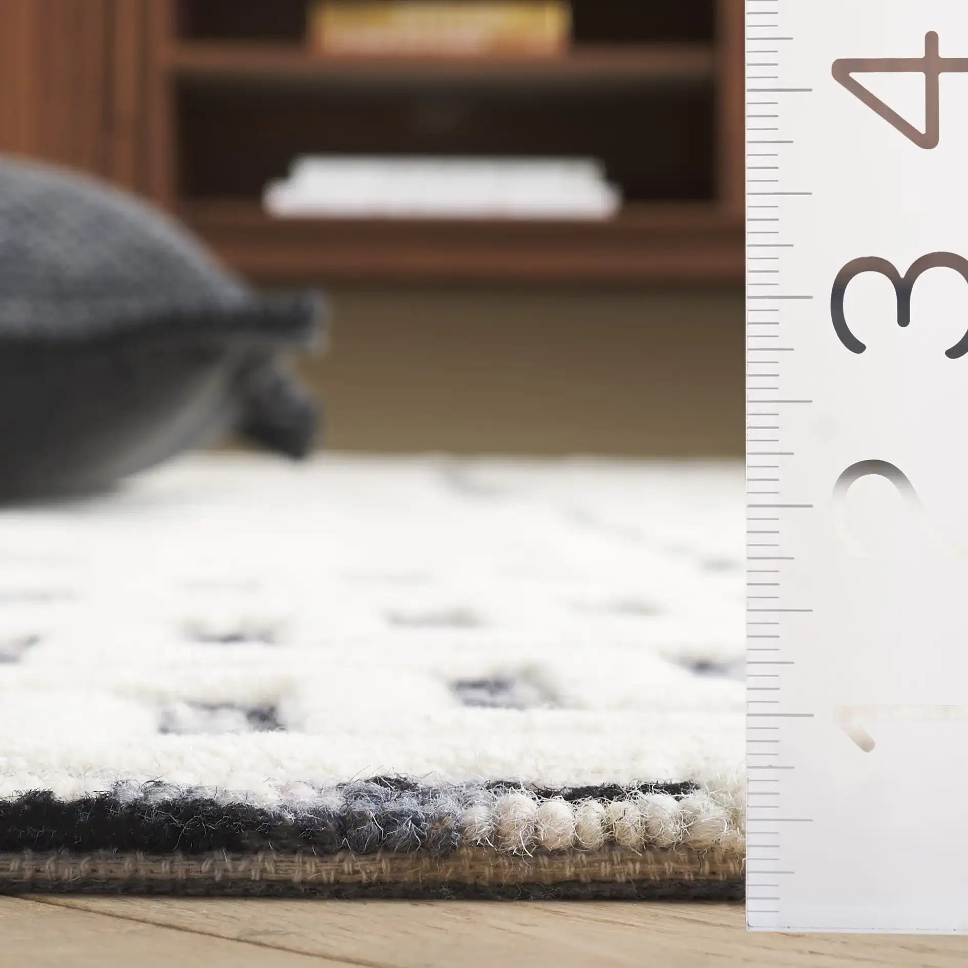 Ebony Patchwork Hand-Tufted Wool Rug in Ivory / Black in a styled room