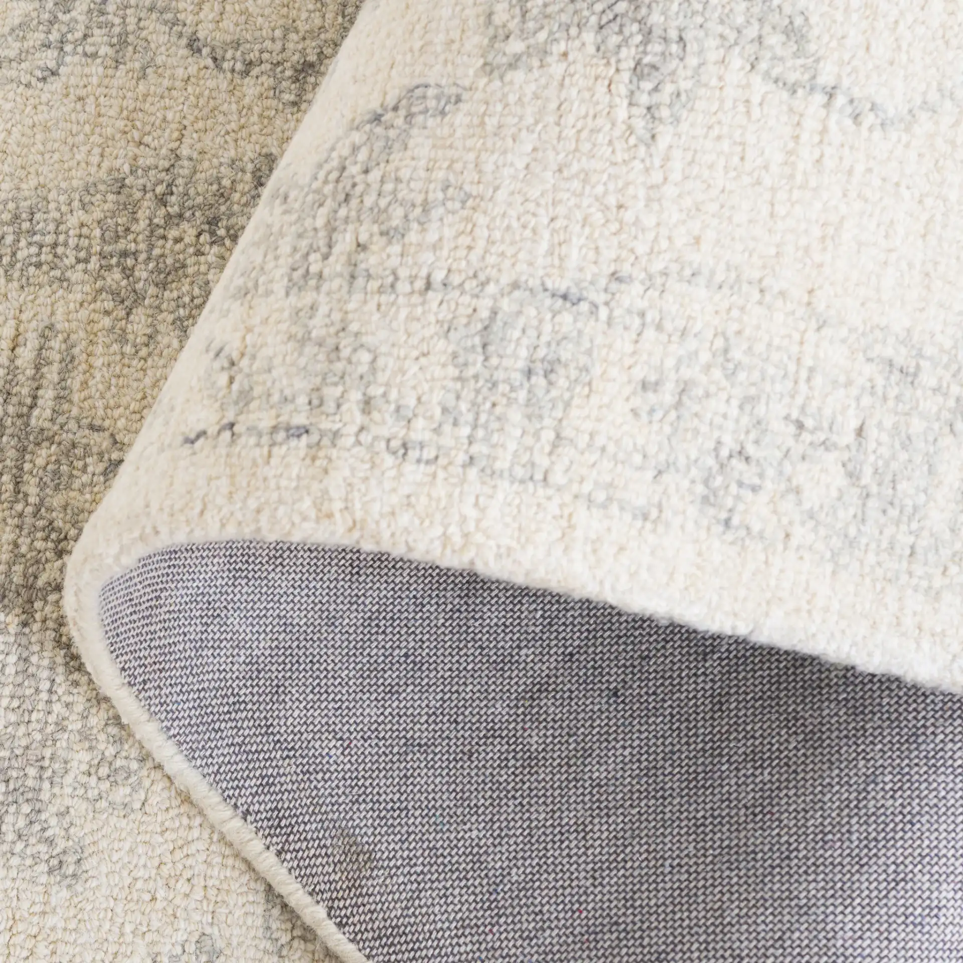 Ebony Floral Hand-Tufted Wool Rug in Ivory / Gray in a styled room
