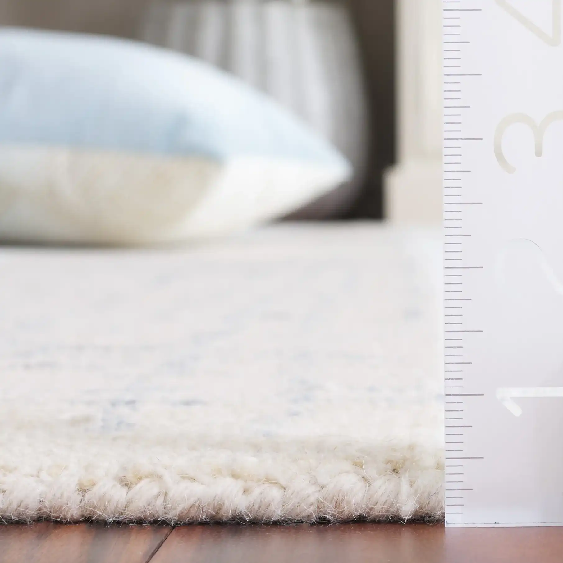 Ebony Broken Grid Hand-Tufted Wool Rug in Ivory / Navy in a styled room