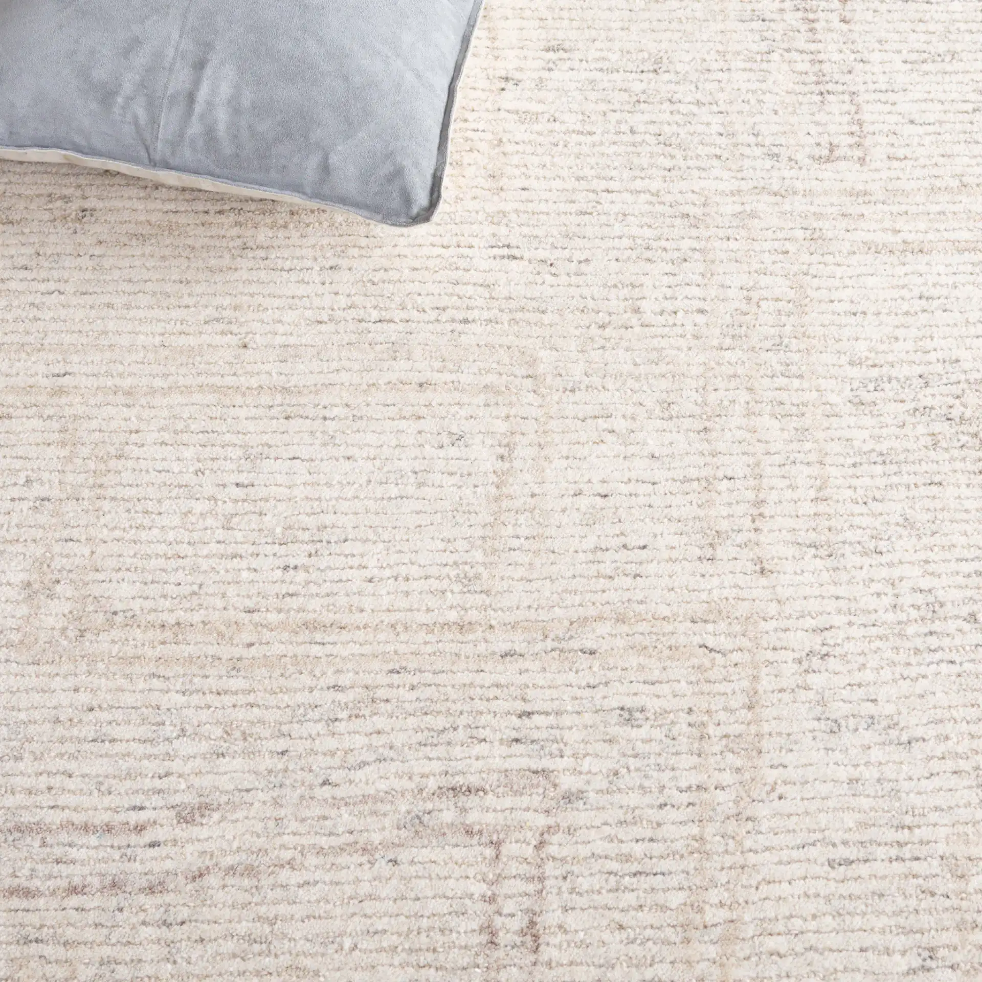 Ebony Subtle Grid Hand-Tufted Wool Rug in Ivory / Beige in a styled room