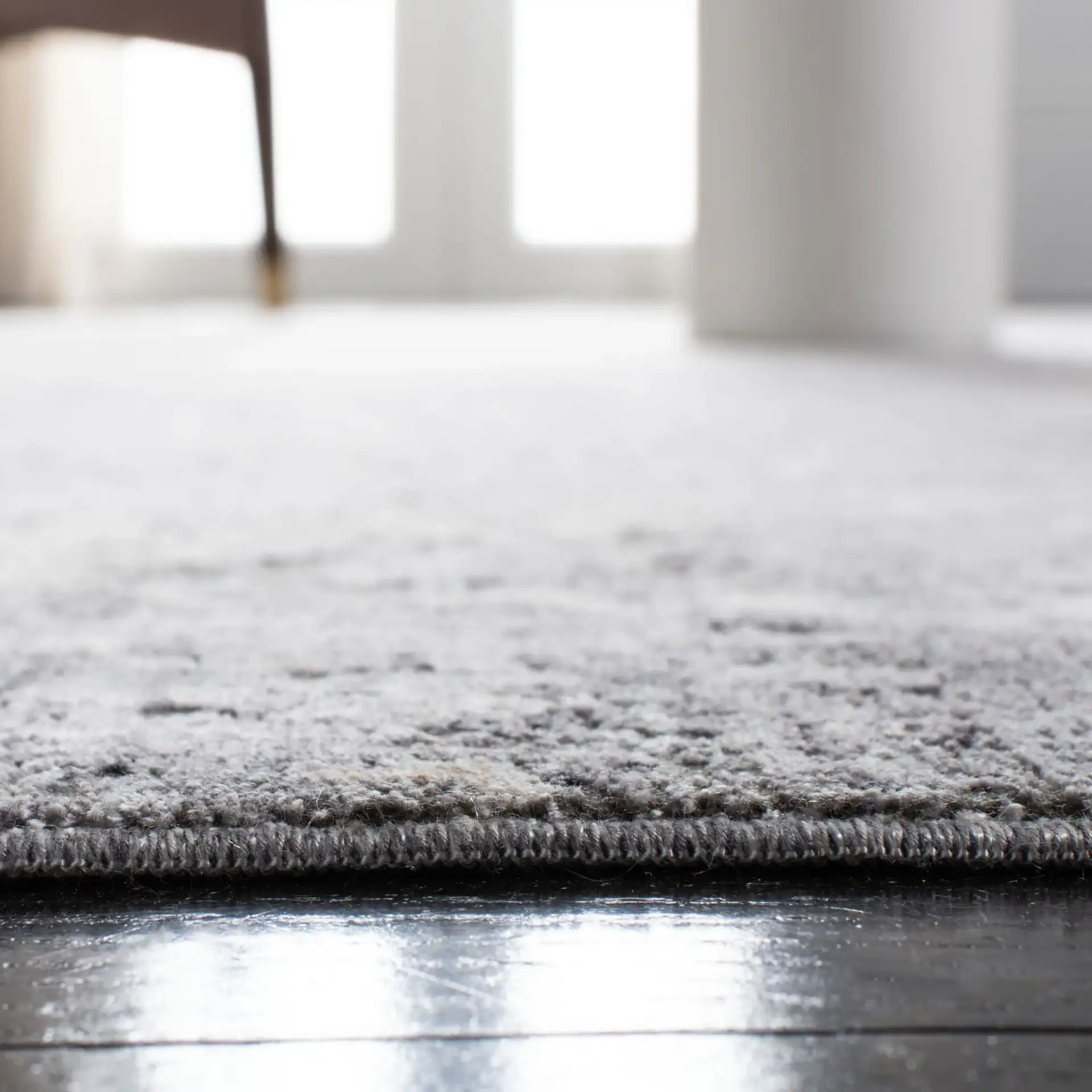 Eclipse Distressed Abstract Rug in Gray / Beige in a styled room
