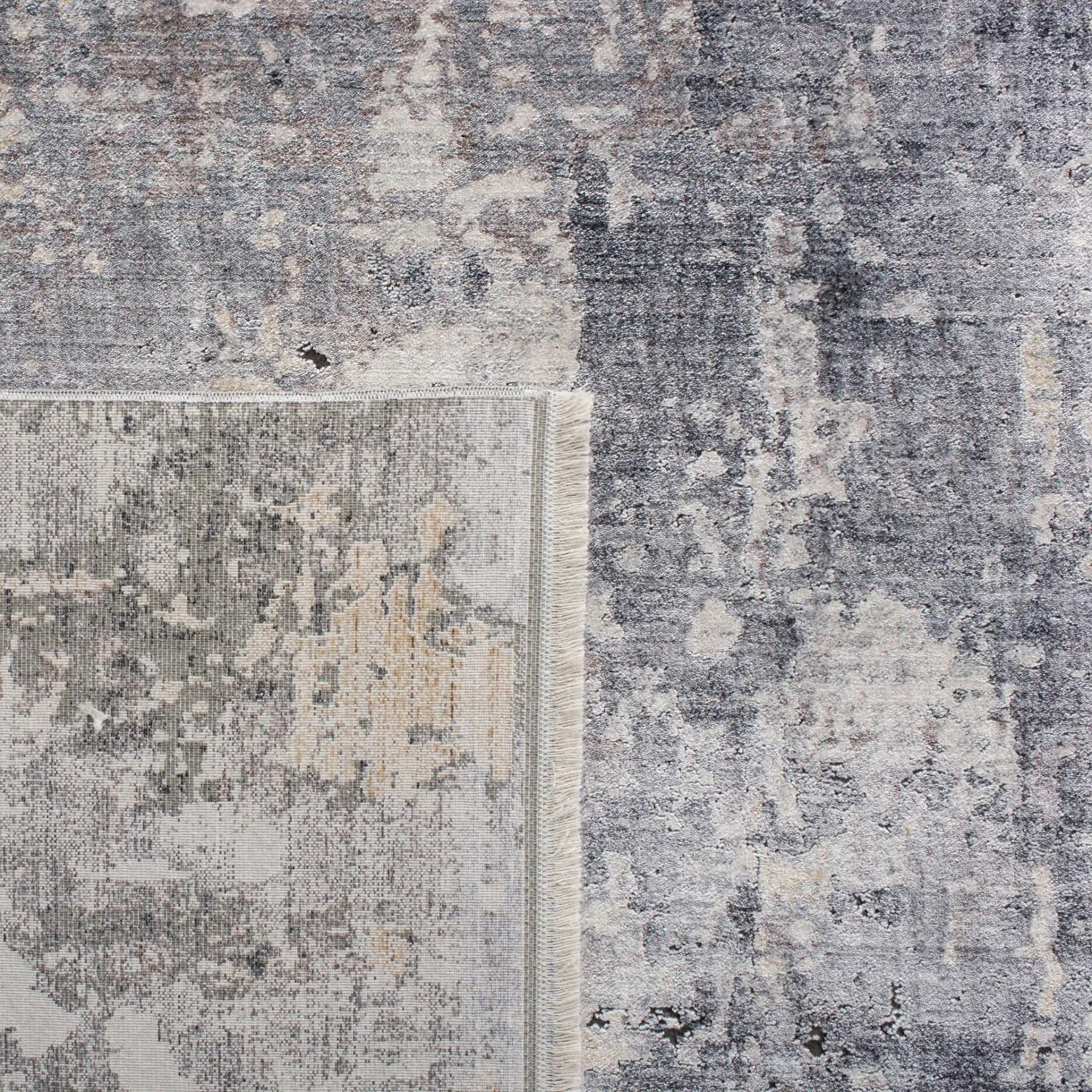 Eclipse Distressed Abstract Rug in Gray / Beige in a styled room