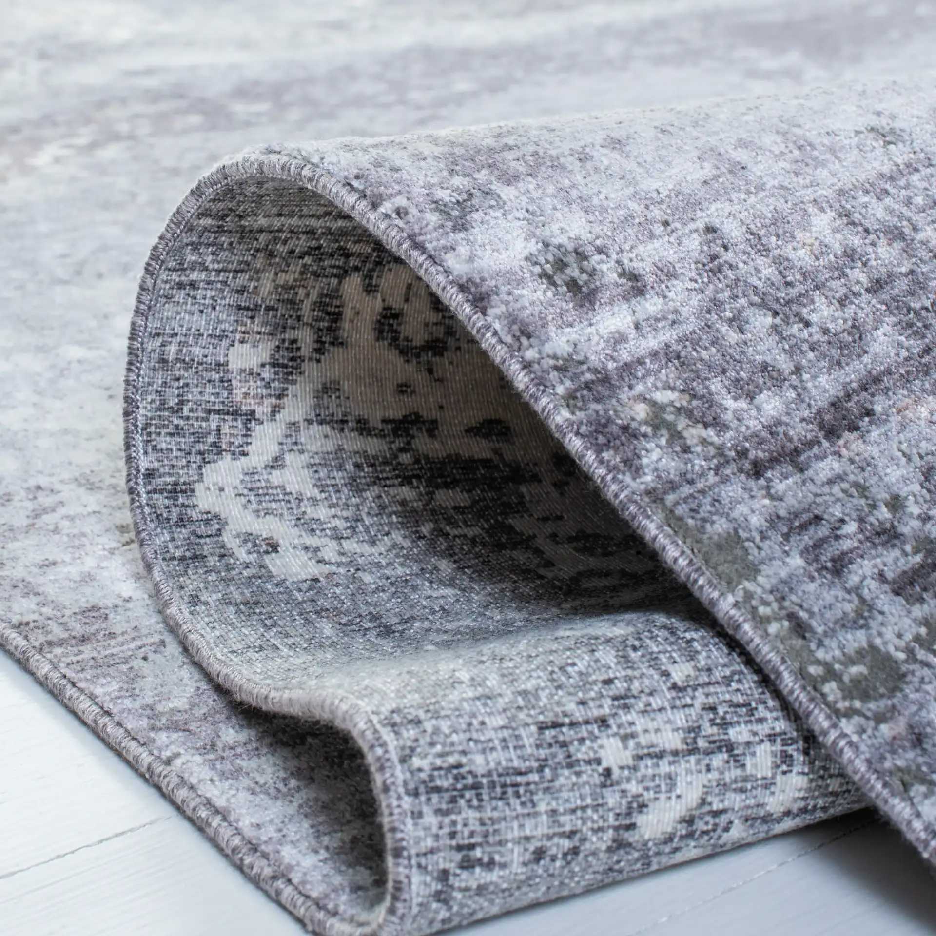 Eclipse Abstract Blocks Rug in Charcoal / Gray in a styled room