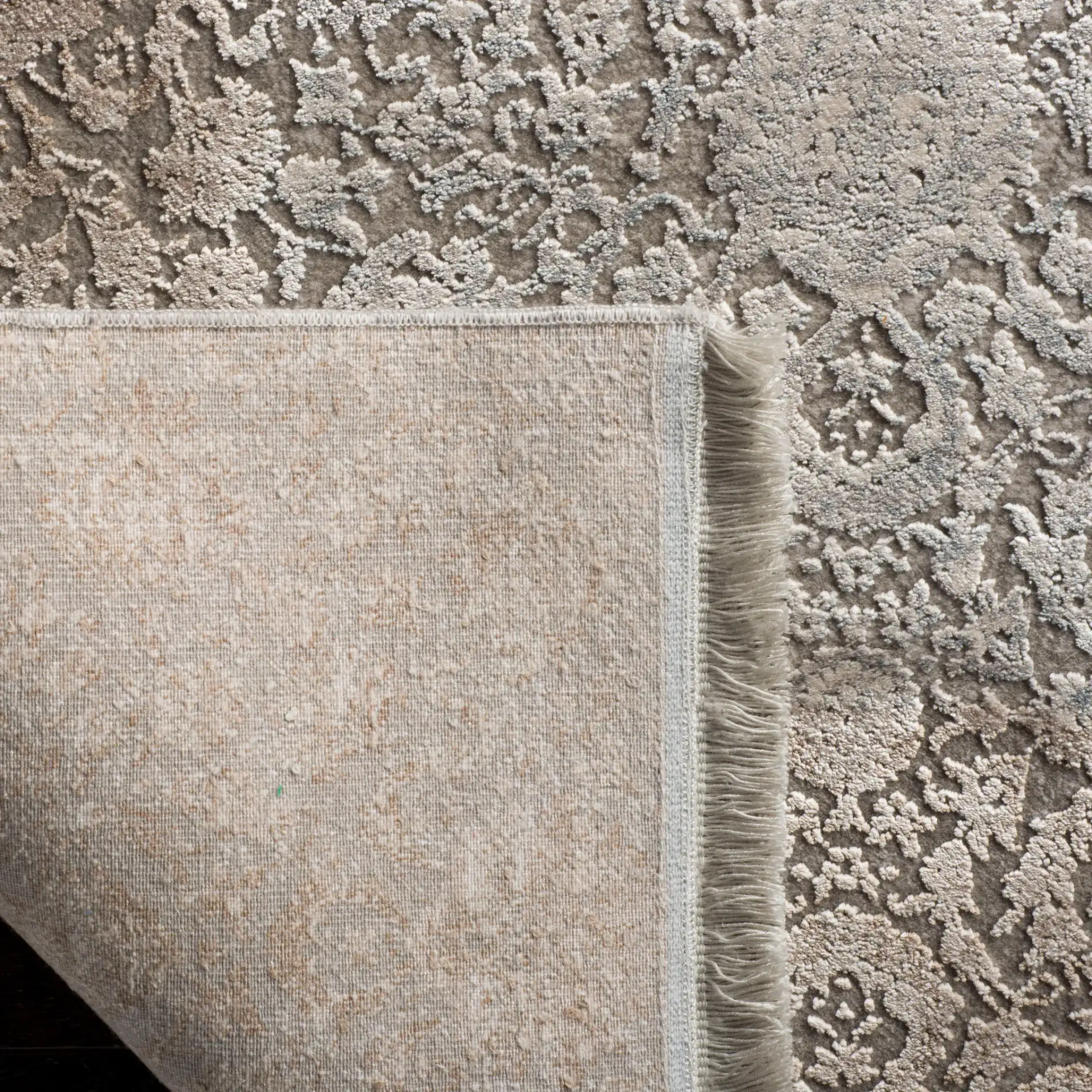 Eclipse Faded Floral Rug in Beige / Light Gray in a styled room