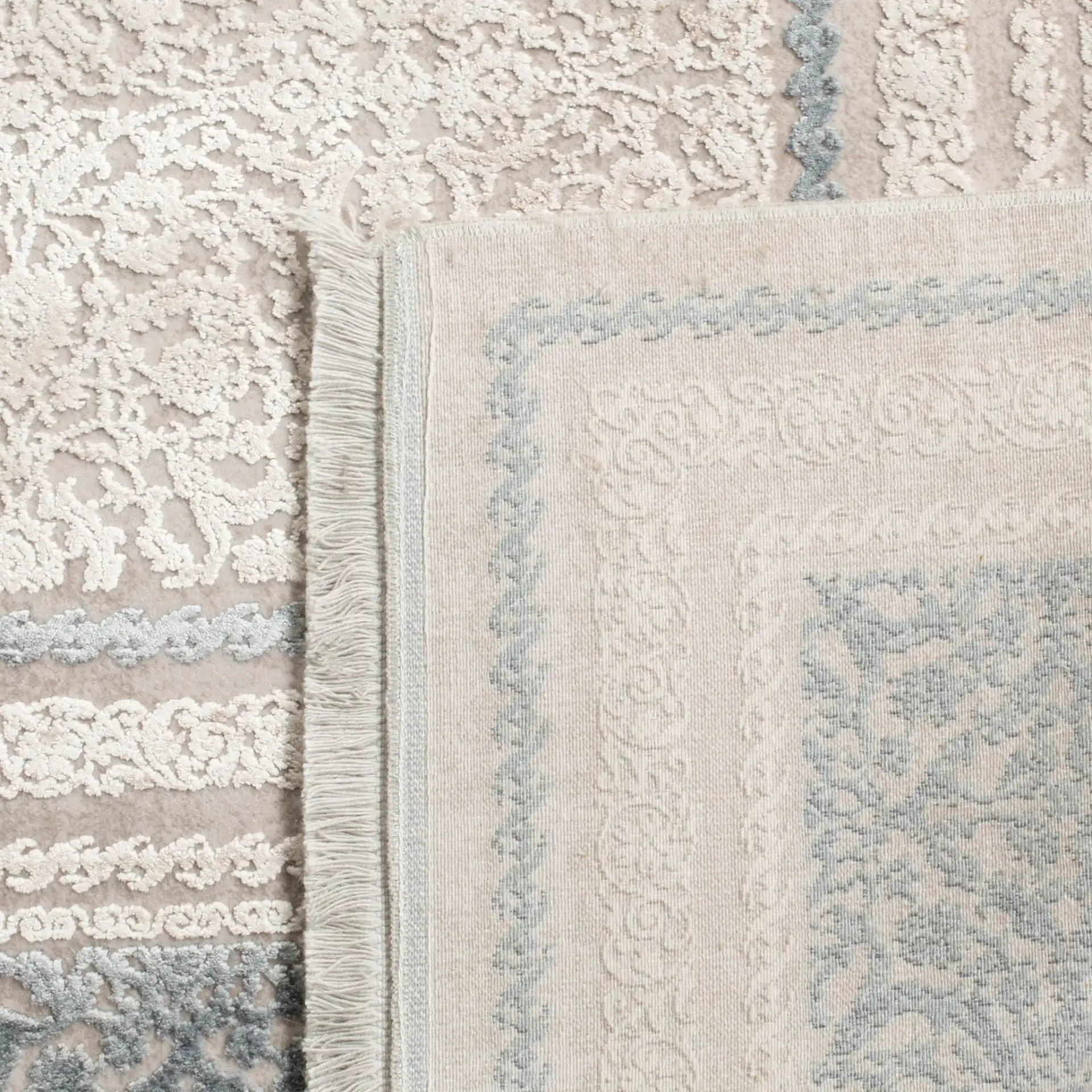 Eclipse Diamond Medallion Rug in Beige / Gray in a styled room