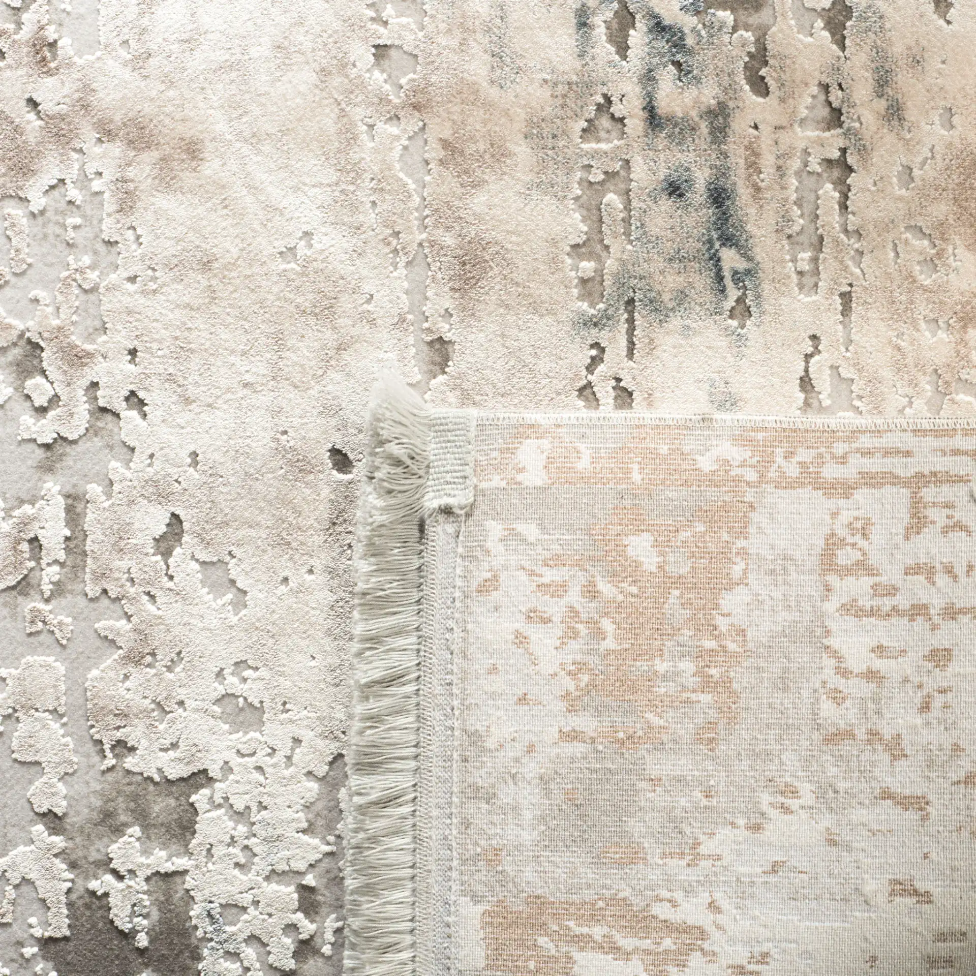 Eclipse Dappled Abstract Rug in Beige / Gray in a styled room