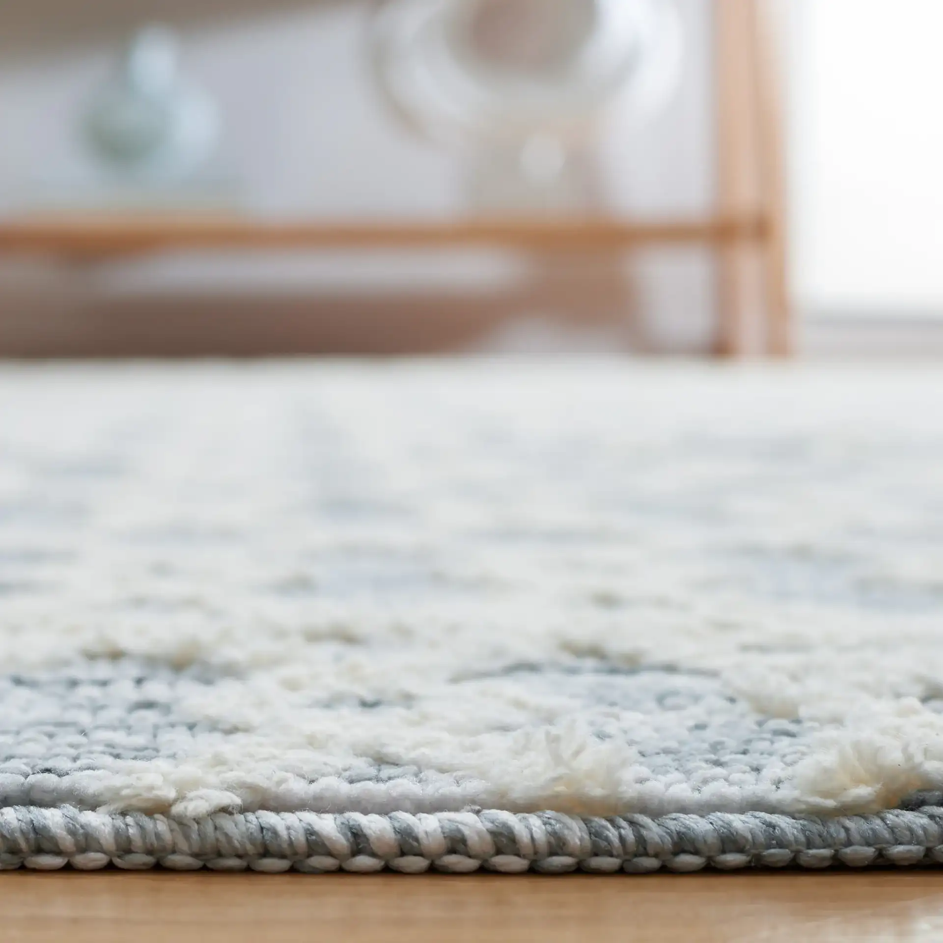 Easy Care Diamond Lattice Washable Rug in Gray / Ivory in a styled room
