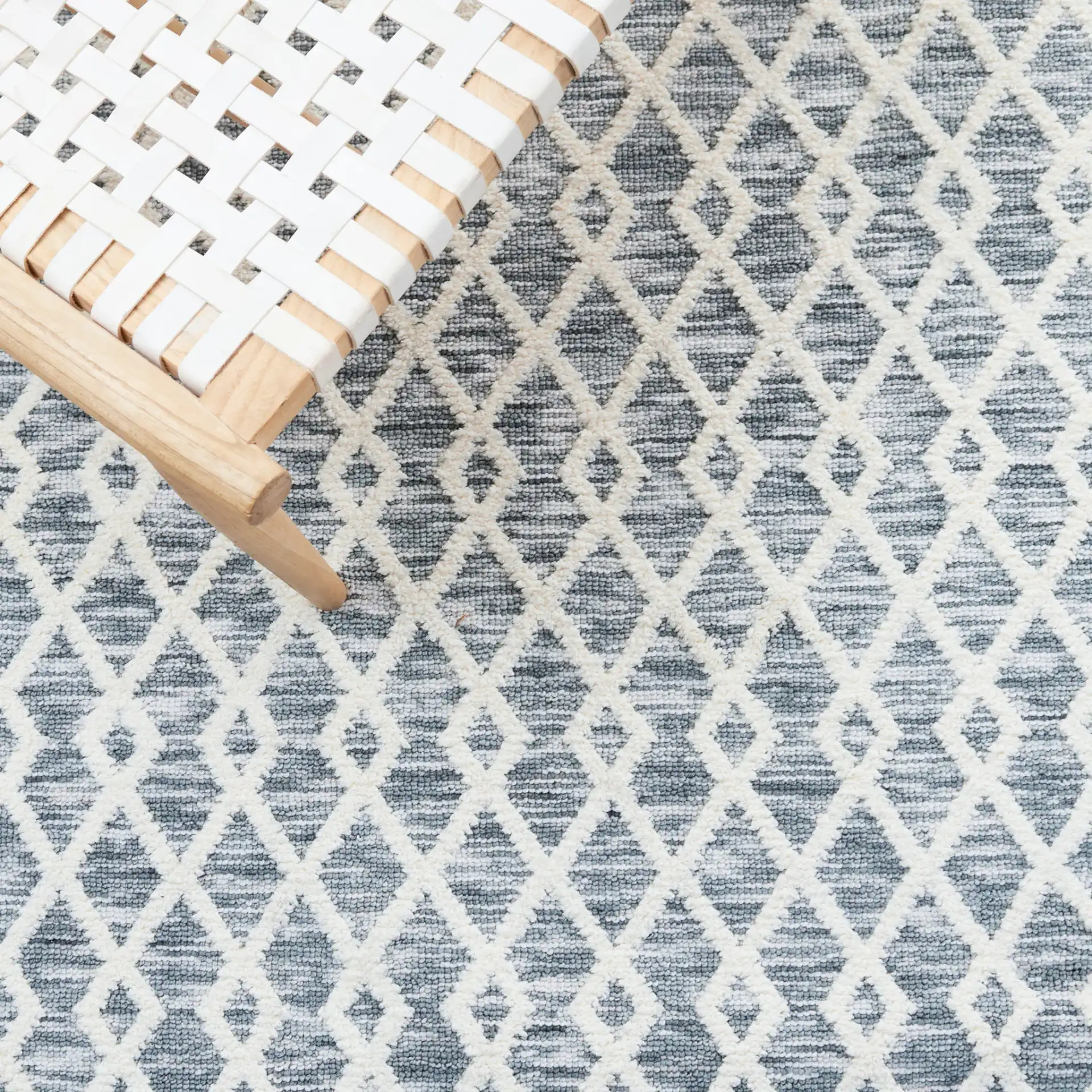 Easy Care Diamond Lattice Washable Rug in Gray / Ivory in a styled room