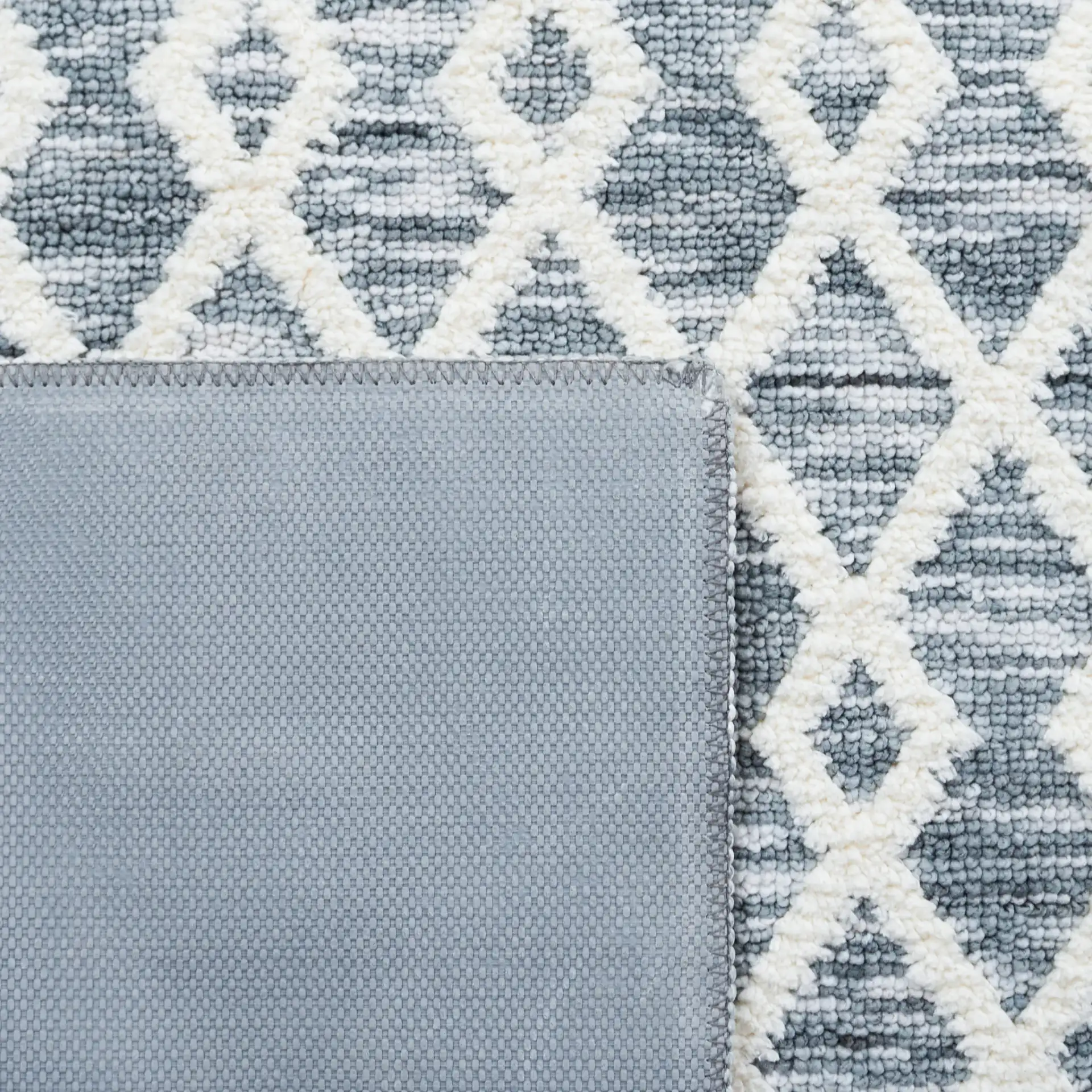 Easy Care Diamond Lattice Washable Rug in Gray / Ivory in a styled room