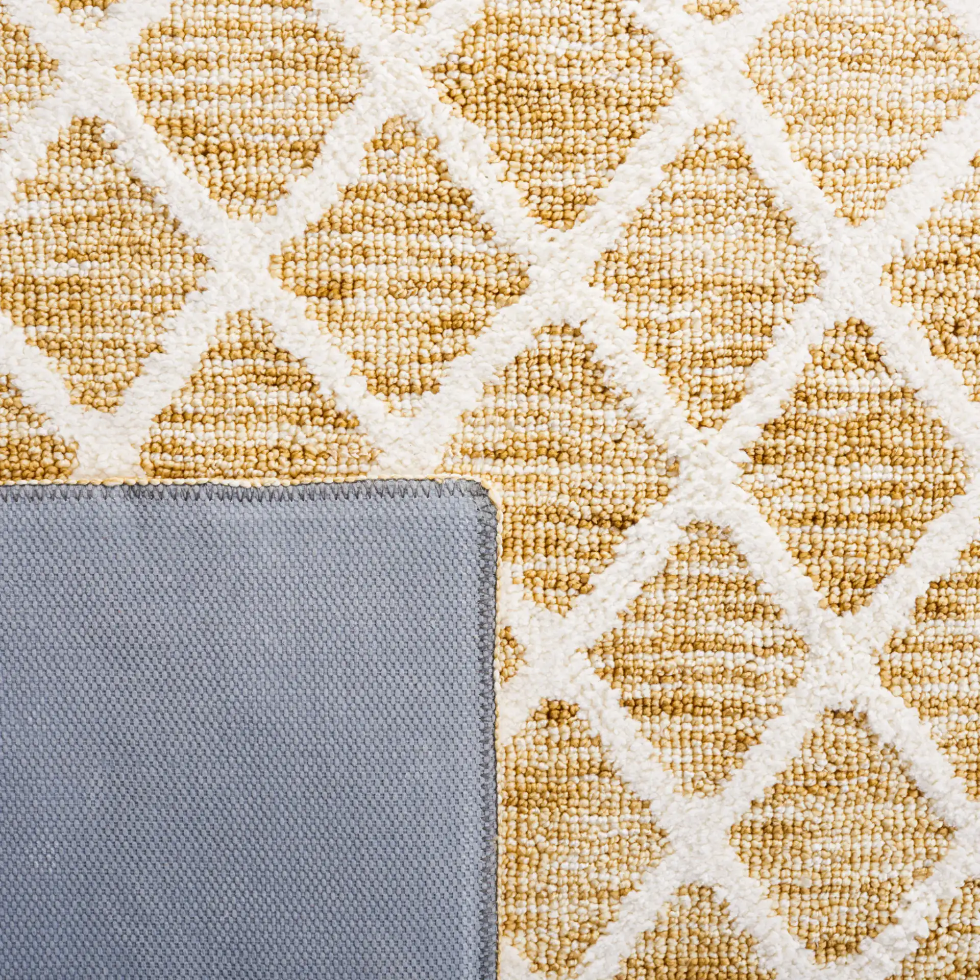 Easy Care Allover Trellis Washable Rug in Gold / Ivory in a styled room