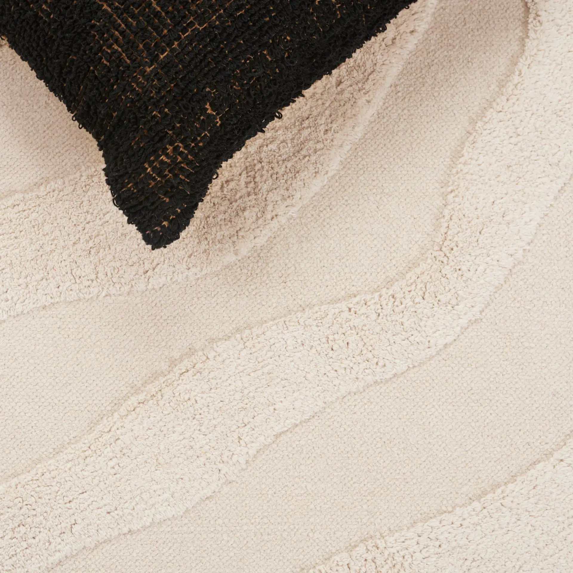 Easy Care Wavy Abstract Hand-Woven Cotton Washable Rug in Ivory in a styled room