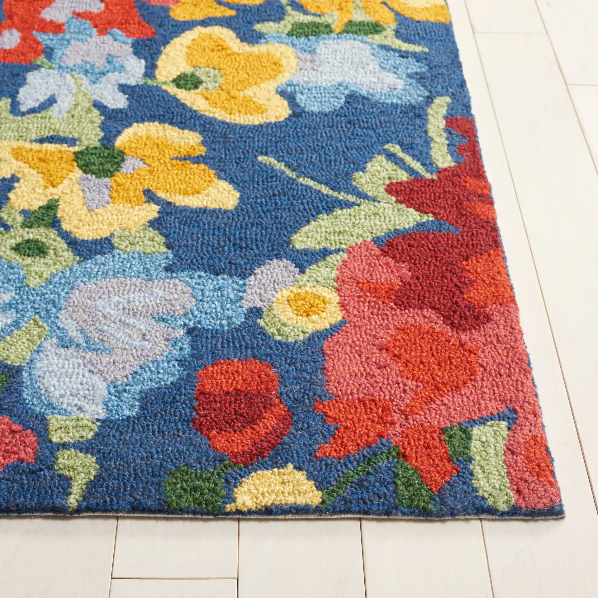 Easy Care Dense Floral Hand-Tufted Rug in Navy / Red in a styled room