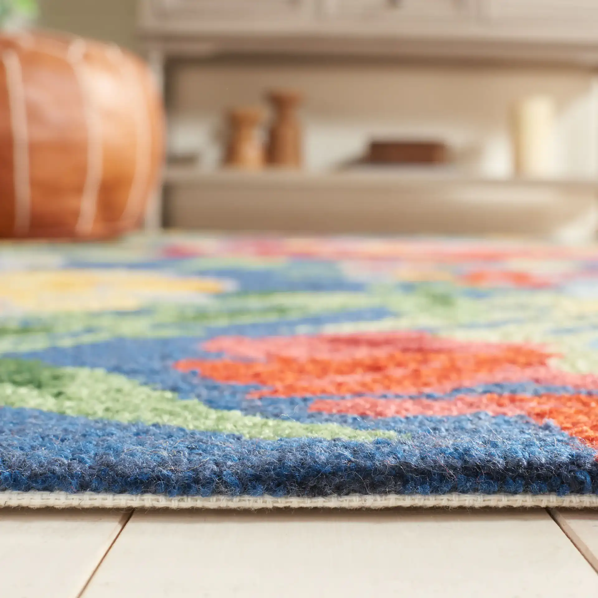 Easy Care Dense Floral Hand-Tufted Rug in Navy / Red in a styled room