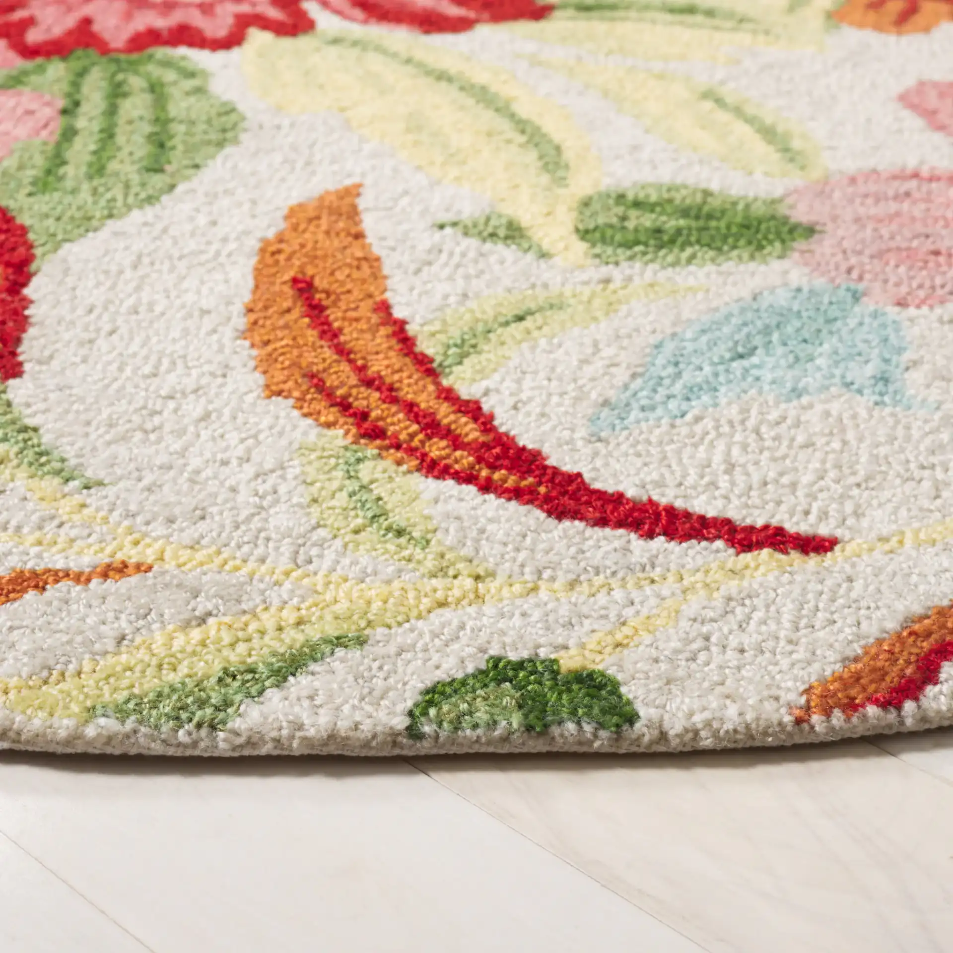 Easy Care Floral Hand-Tufted Rug in Ivory / Red in a styled room