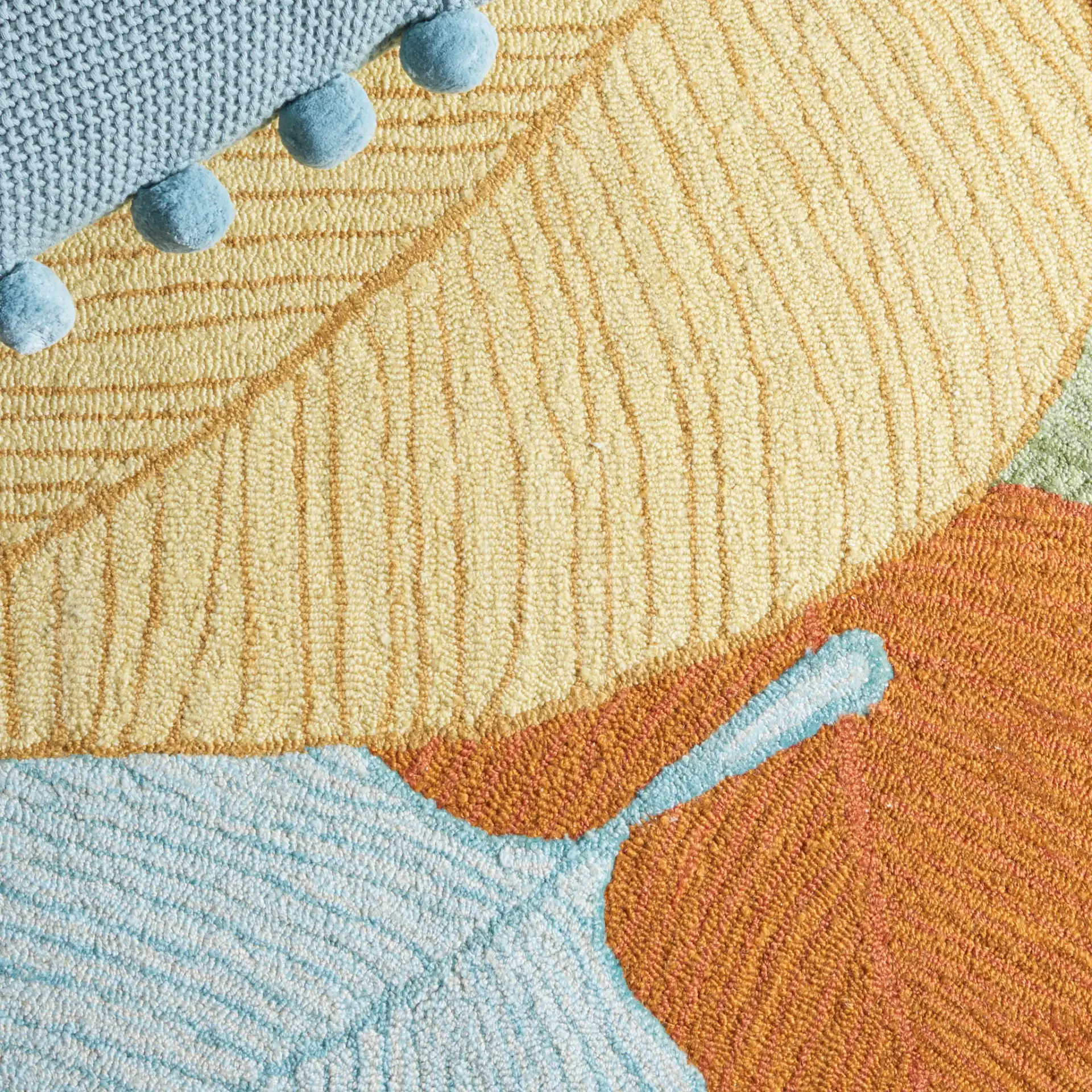 Easy Care Overlapping Leaves Hand-Tufted Rug in Rust / Green in a styled room