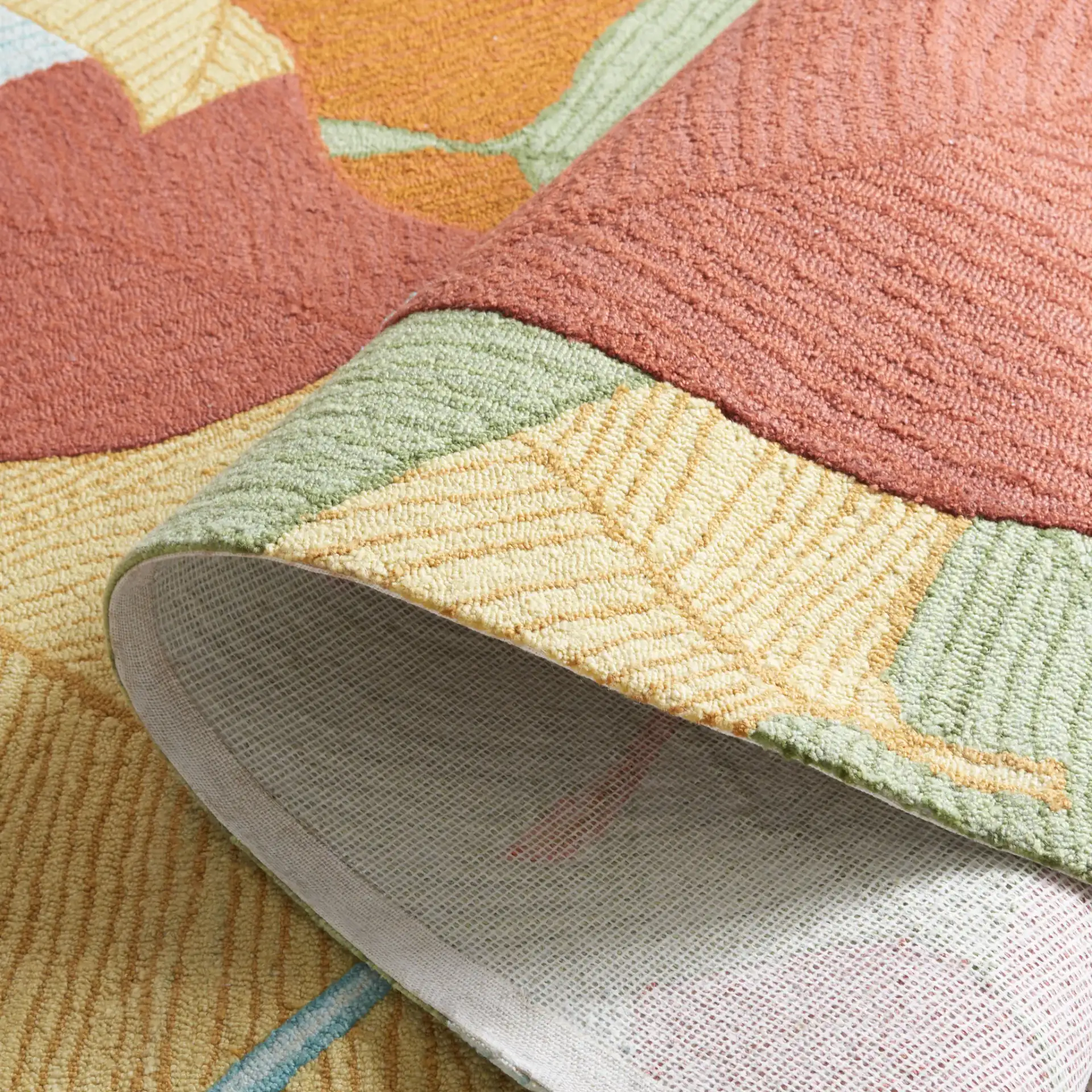 Easy Care Overlapping Leaves Hand-Tufted Rug in Rust / Green in a styled room