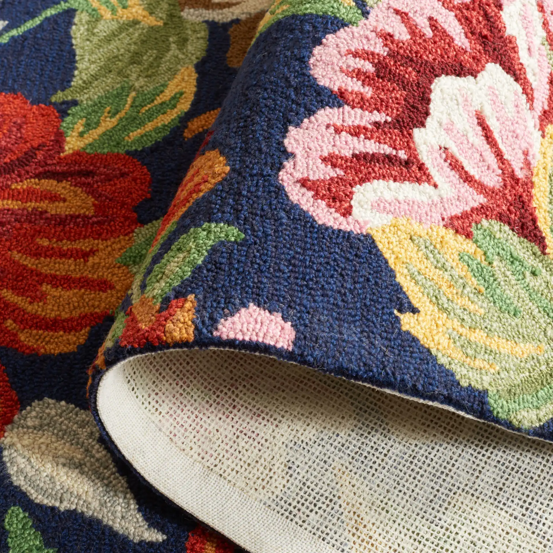 Easy Care Allover Floral Hand-Tufted Rug in Navy / Red in a styled room