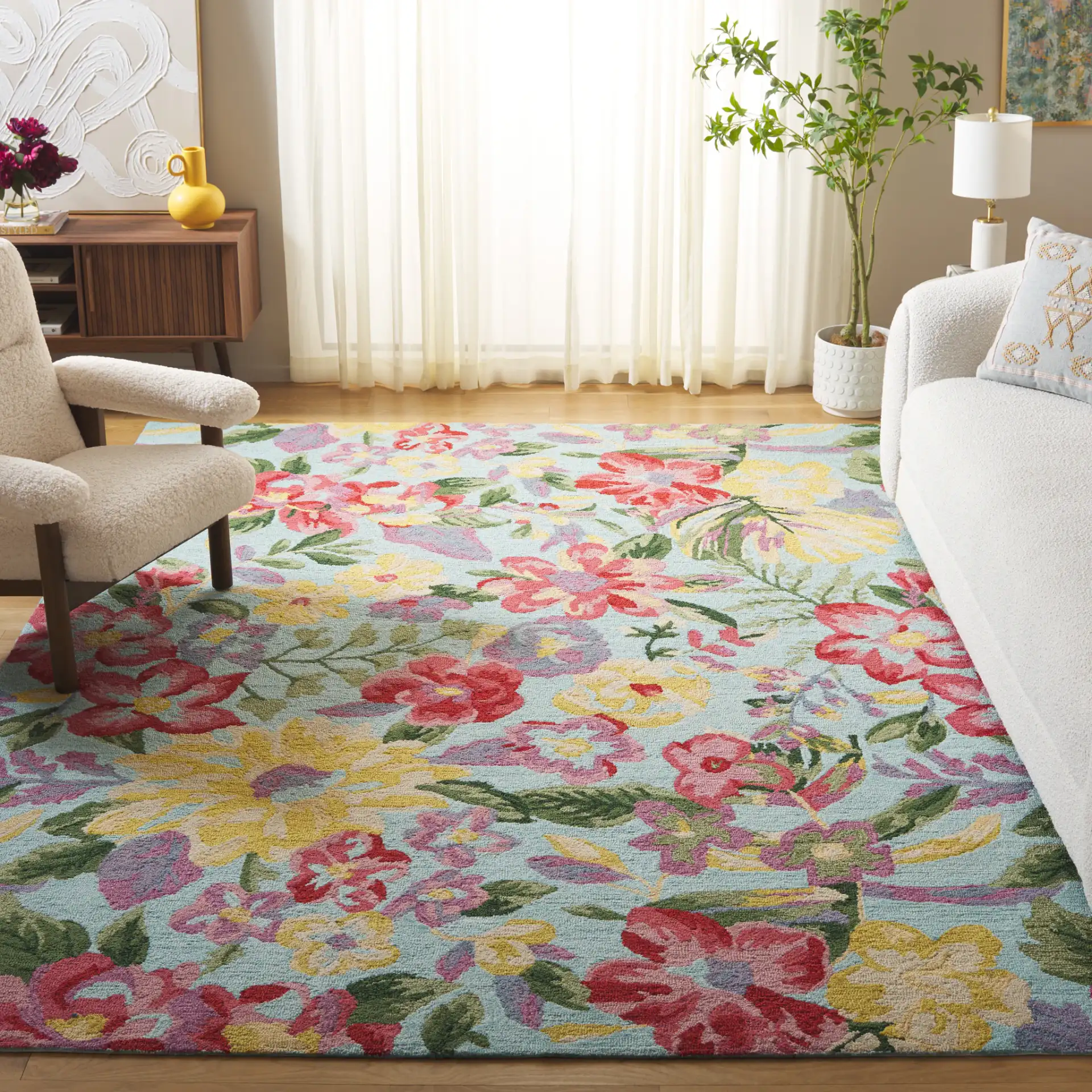 Easy Care Floral Bloom Hand-Tufted Rug in Blue / Pink in a styled room