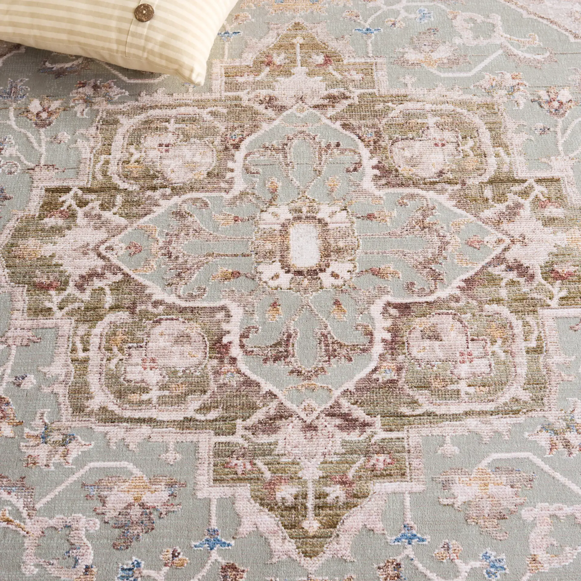 Ellwood Medallion Bordered Rug in Olive / Beige in a styled room