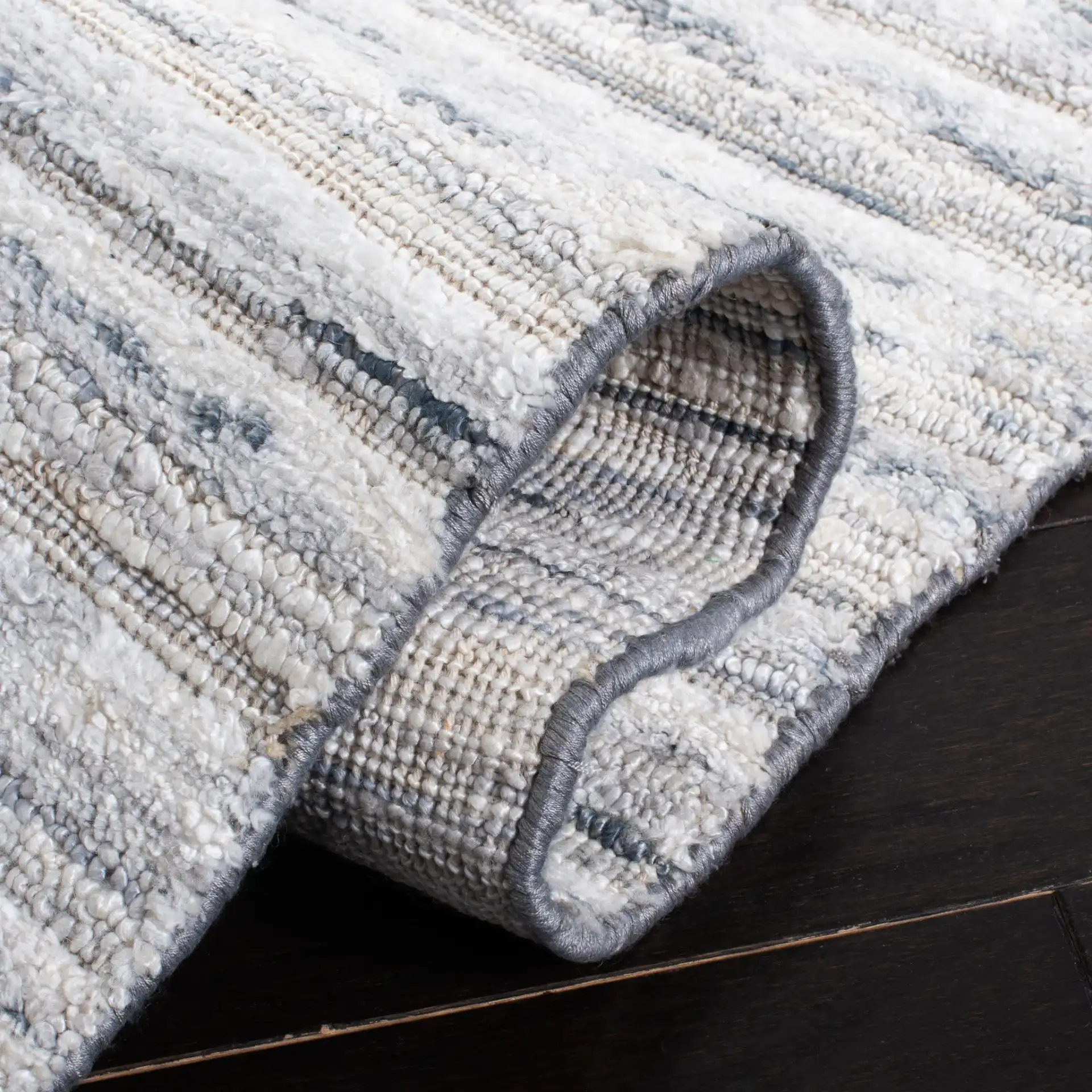 Elements Scandinavian Striped Loom-Knotted Bamboo Silk Rug in Blue / Ivory in a styled room