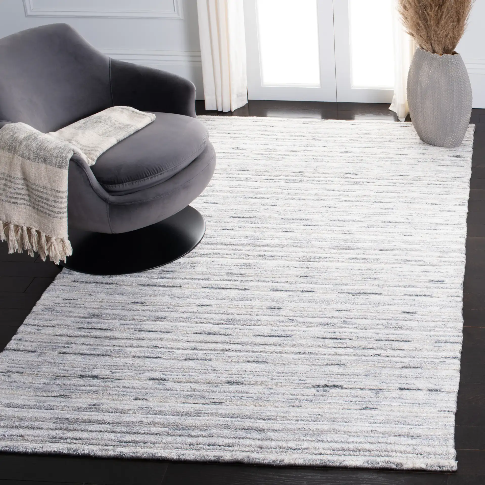 Elements Scandinavian Striped Loom-Knotted Bamboo Silk Rug in Blue / Ivory in a styled room
