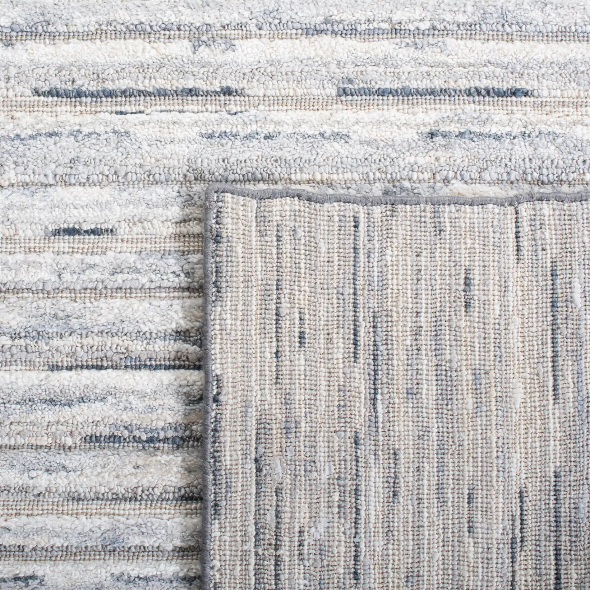 Elements Scandinavian Striped Loom-Knotted Bamboo Silk Rug in Blue / Ivory in a styled room