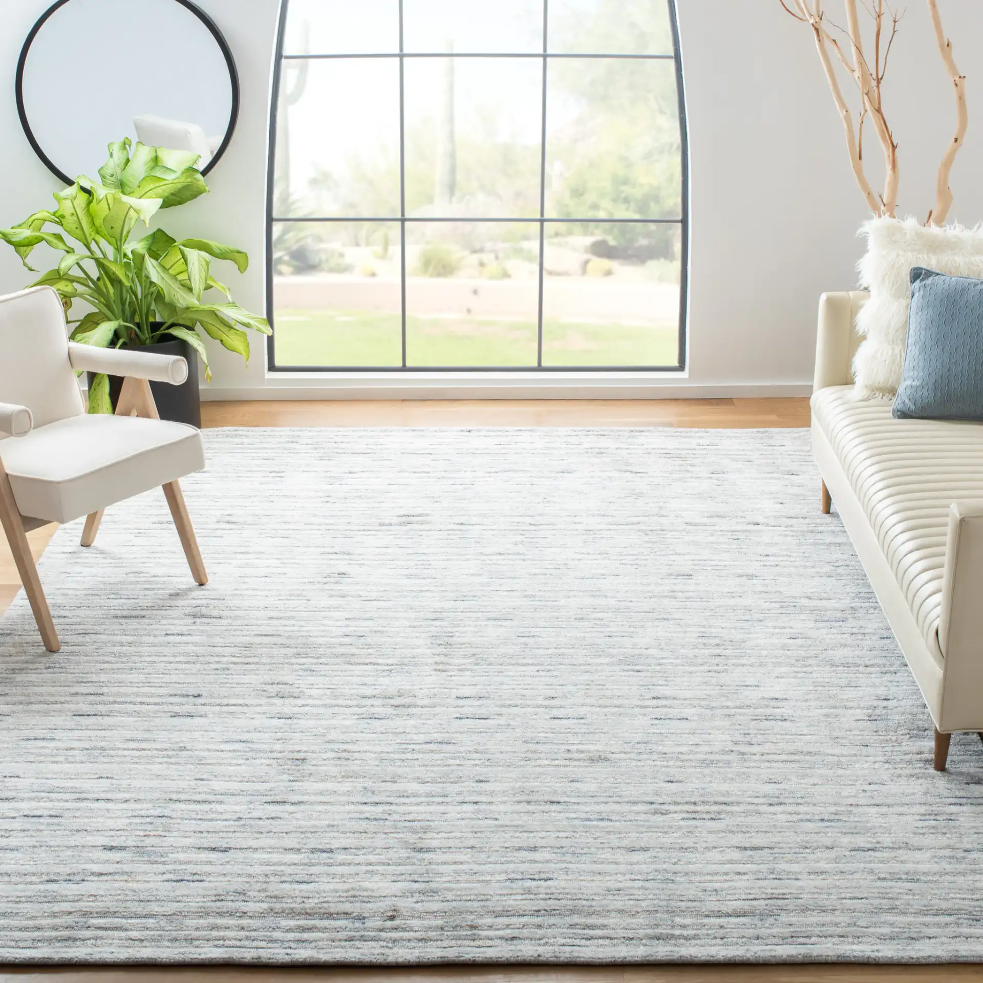Elements Scandinavian Striped Loom-Knotted Bamboo Silk Rug in Blue / Ivory in a styled room