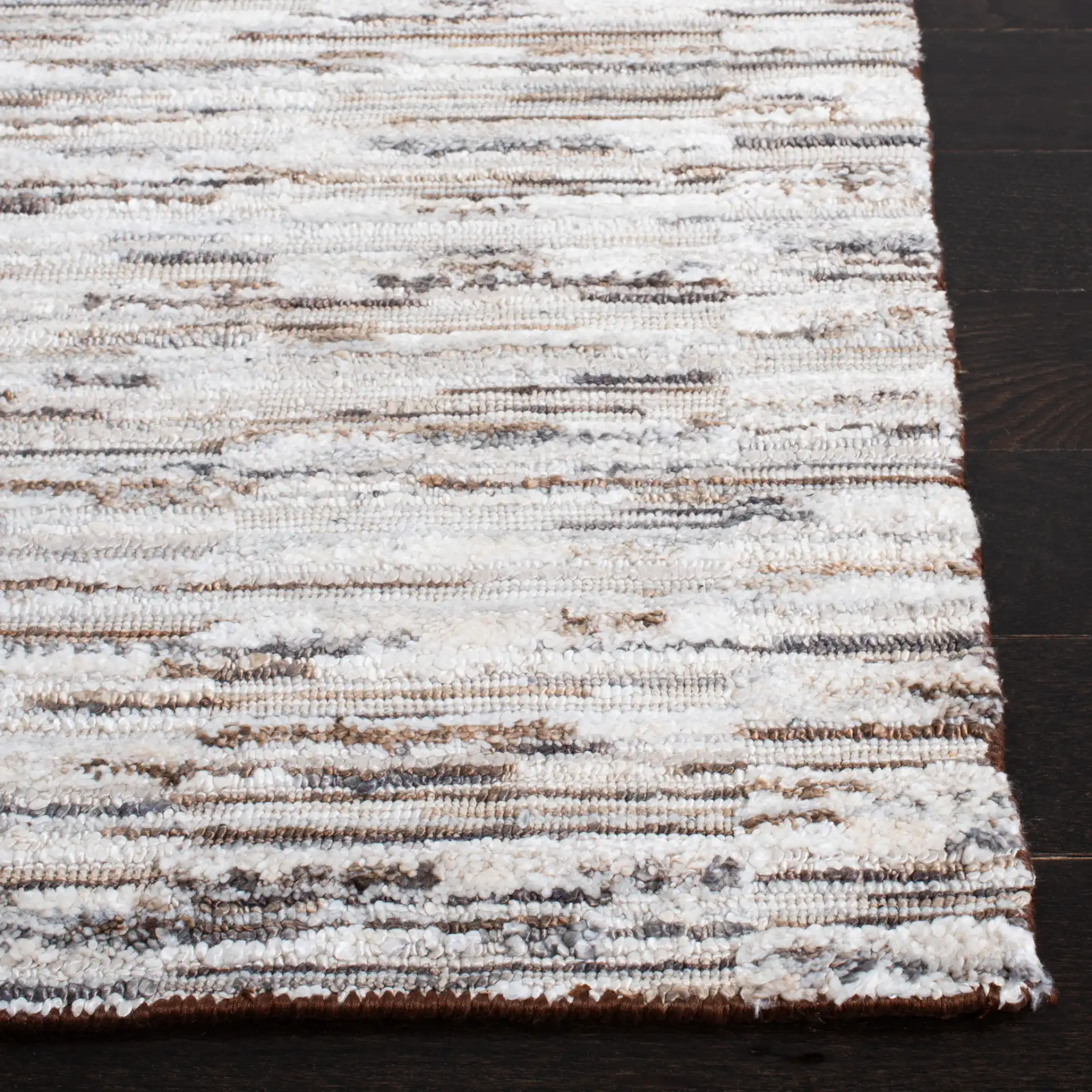 Elements Broken Stripe Loom-Knotted Bamboo Silk Rug in Brown / Light Gray in a styled room