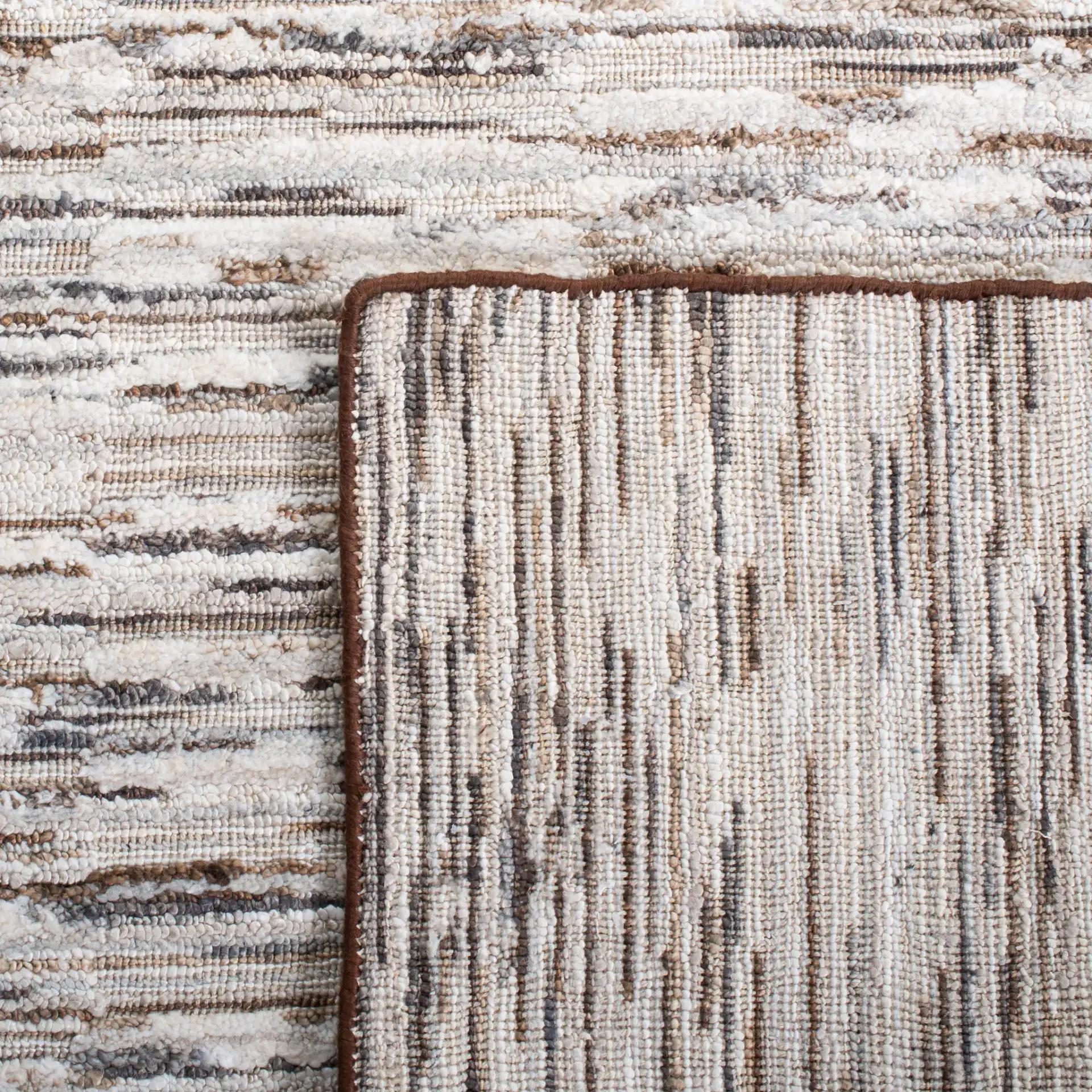Elements Broken Stripe Loom-Knotted Bamboo Silk Rug in Brown / Light Gray in a styled room
