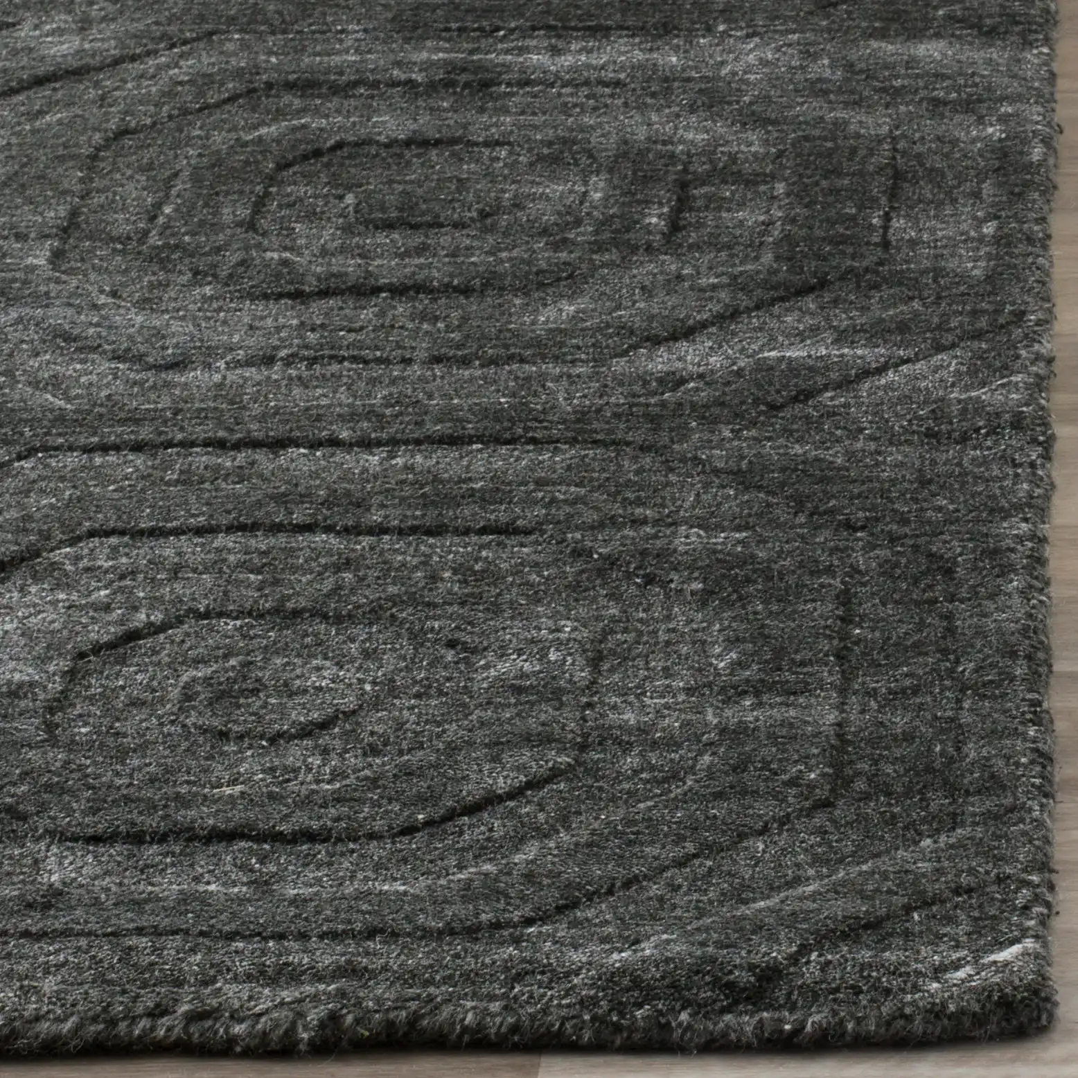 Elements Concentric Ring Loom-Knotted Rug in Dark Gray in a styled room