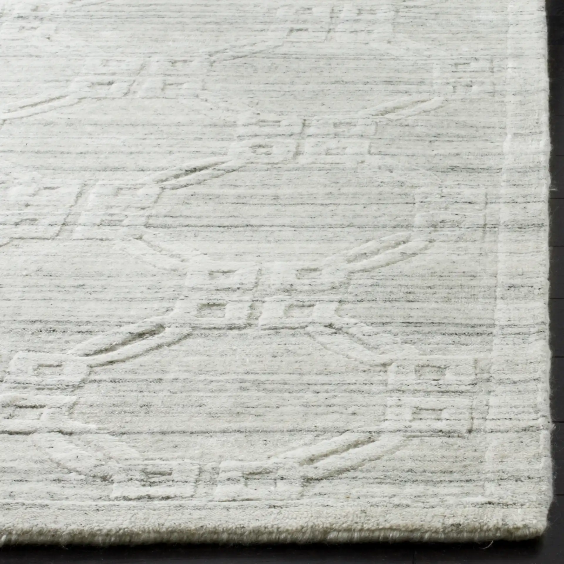 Elements Interlocking Ring Loom-Knotted Rug in Light Gray in a styled room